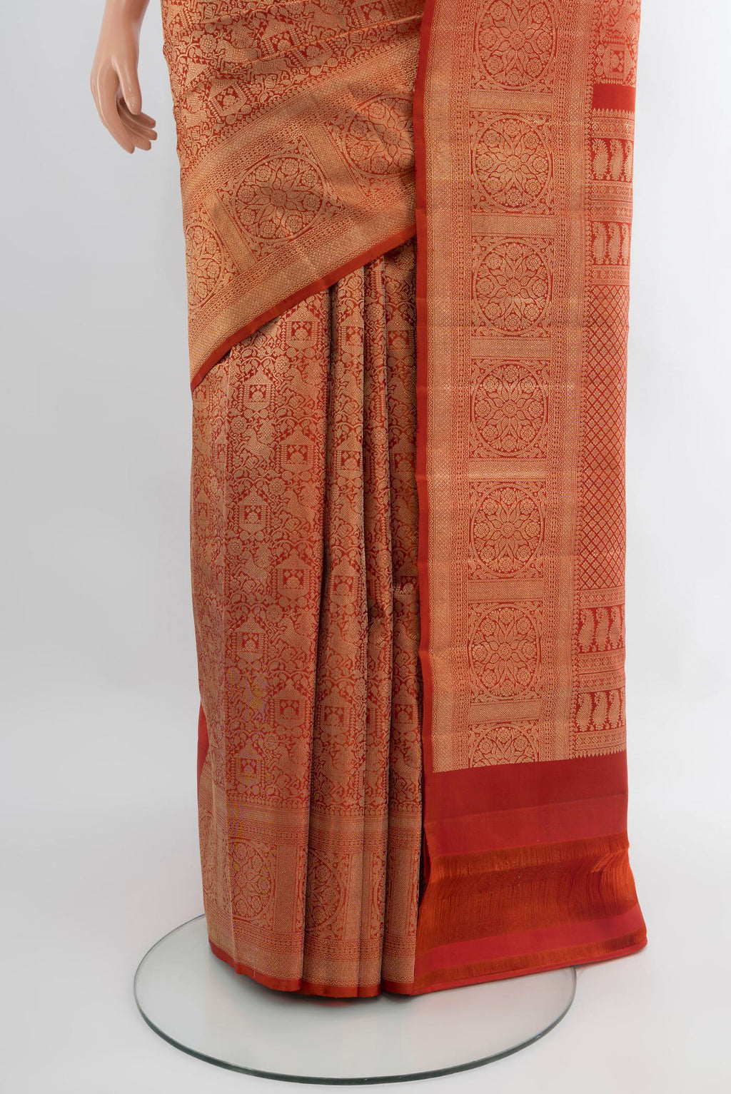 Pleats and pallu of Rust Kanchipuram Silk Saree with Zari Brocade on the body and Zari Border. 