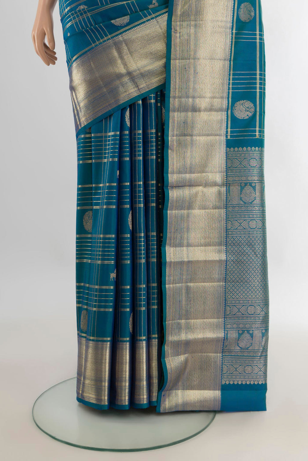 Pleats and pallu of Pure Silk Peacock Blue Kanchipuram Saree with Checked design on the body and Zari Border. 