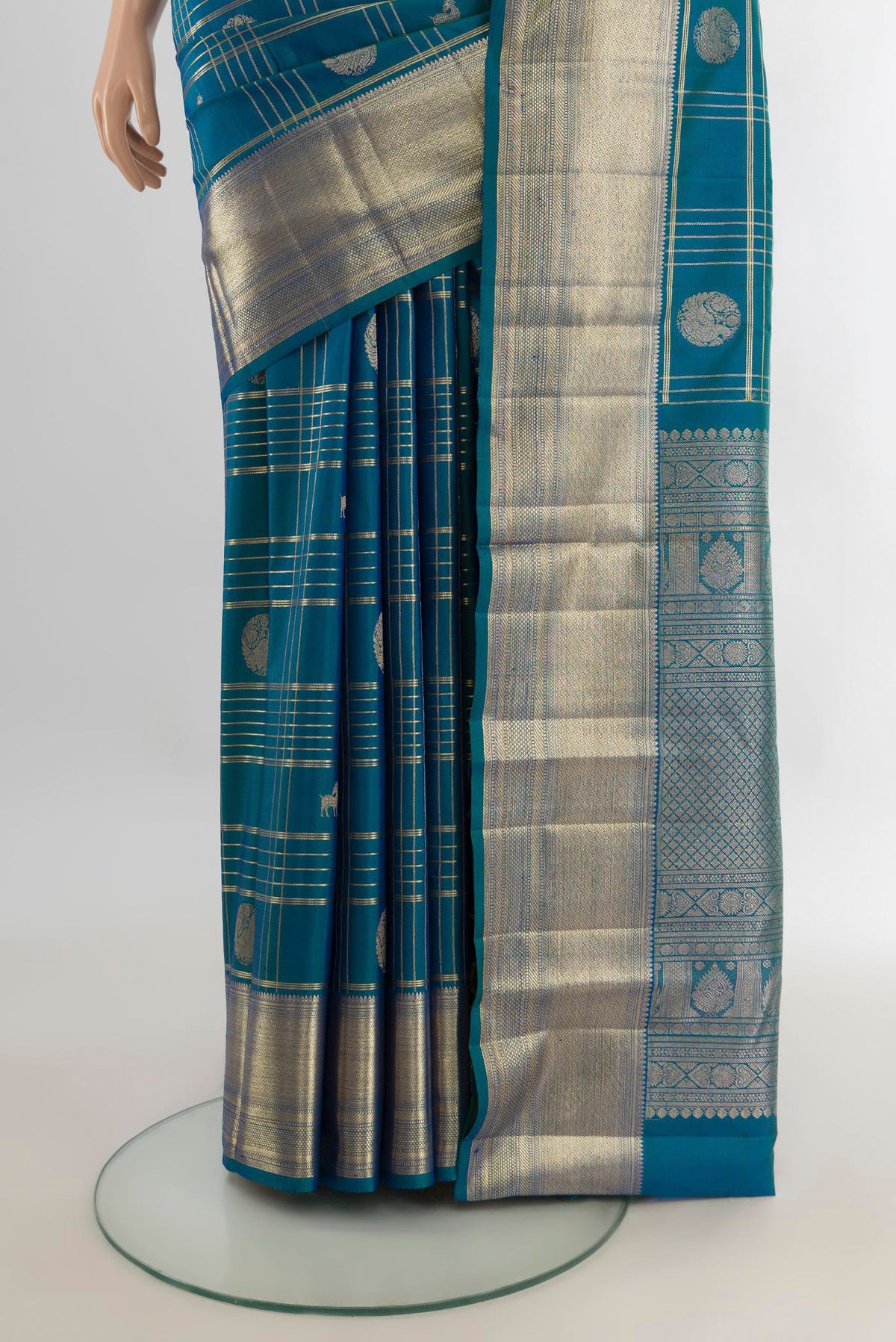 Pleats and pallu of Pure Silk Peacock Blue Kanchipuram Saree with Checked design on the body and Zari Border. 