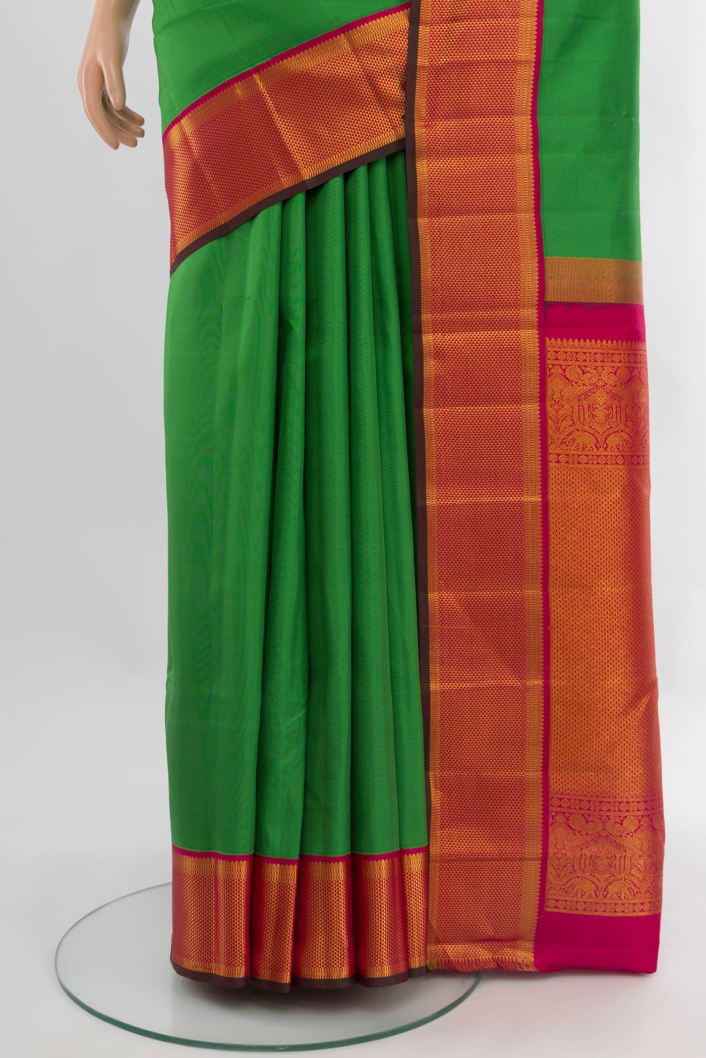 Pleats and pallu of Green Kanchipuram Silk Saree with Plain Body and Zari Border. 