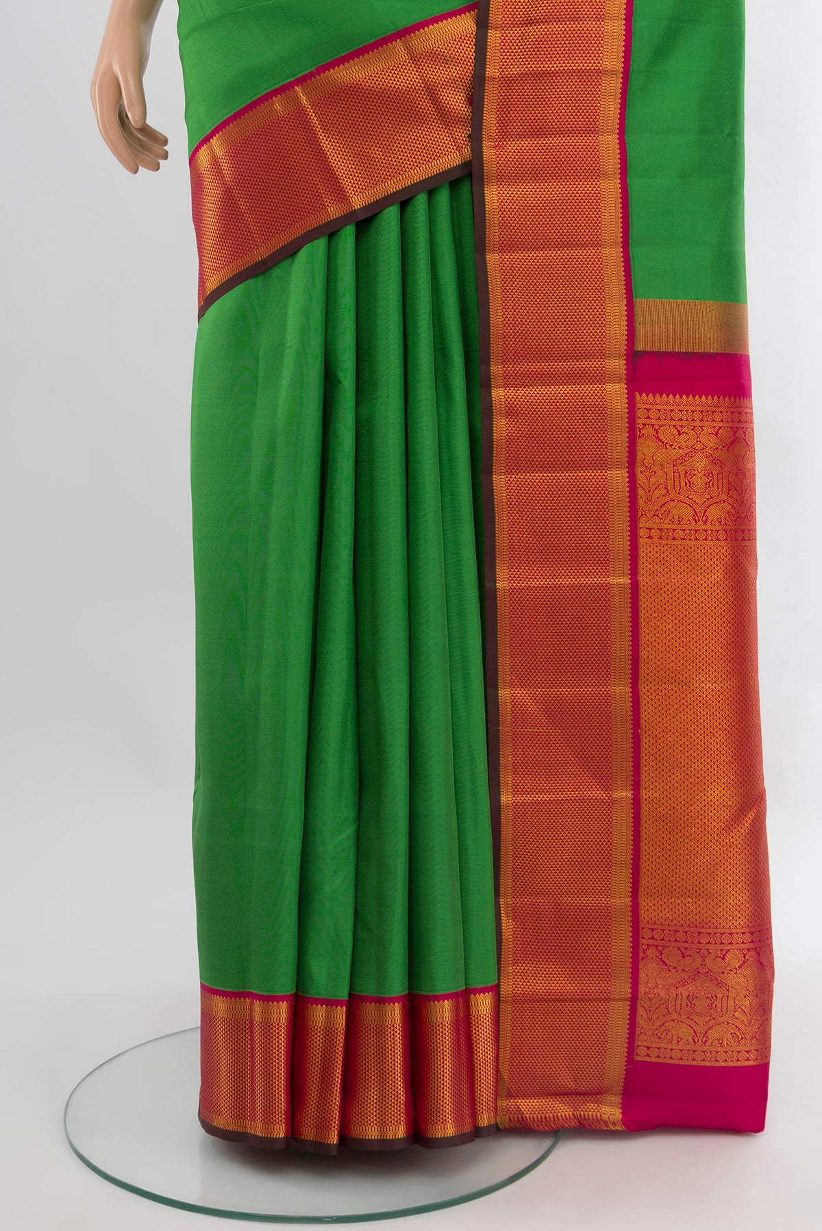 Pleats and pallu of Green Kanchipuram Silk Saree with Plain Body and Zari Border. 