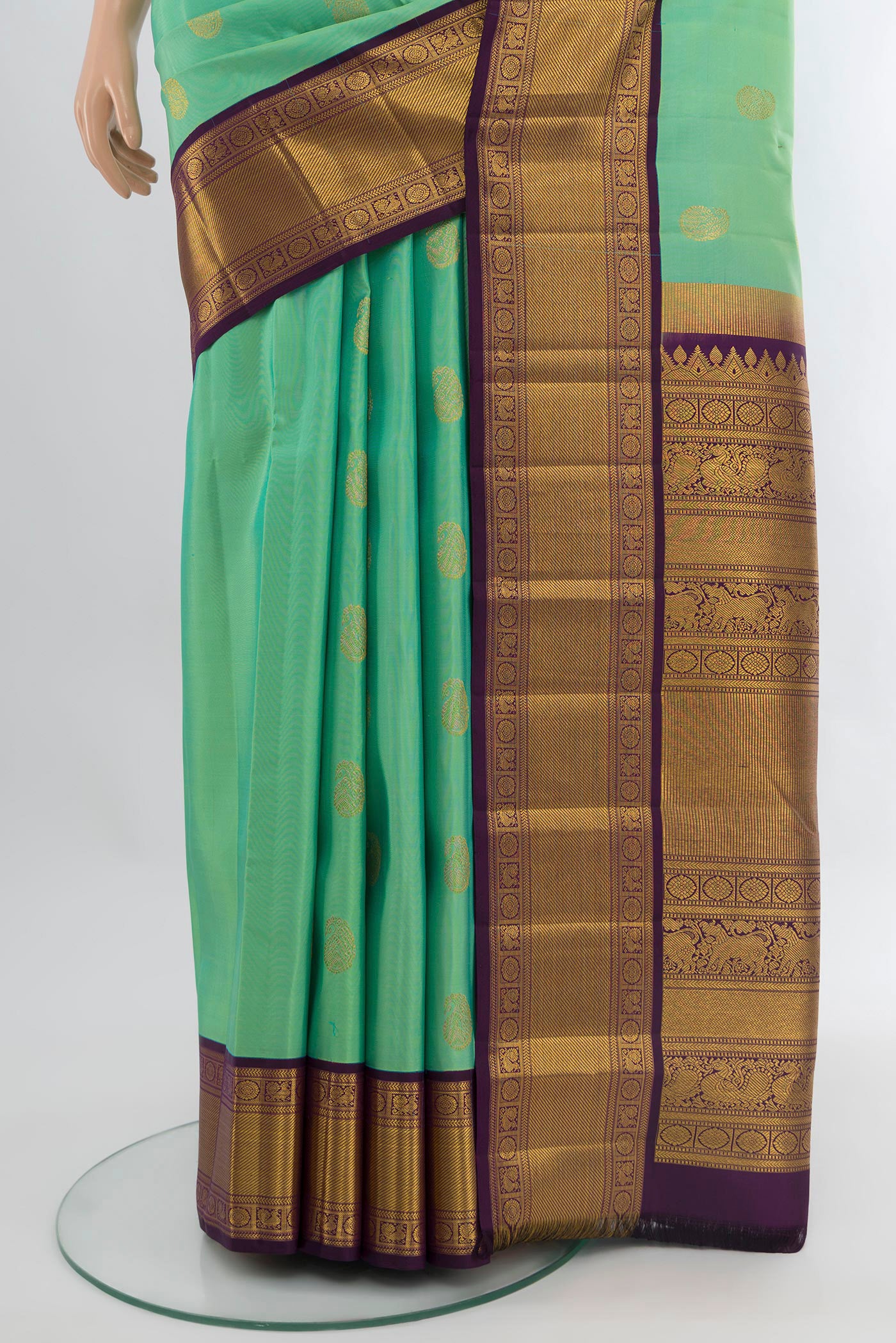 Pleats and pallu of Sea Green Kanjivaram Silk Saree with Zari Butta on the body and Zari Border. 