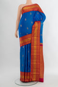 Royal Blue Kanjivaram Silk Saree with Zari Butta on the body and Zari Border.  displayed on a mannequin