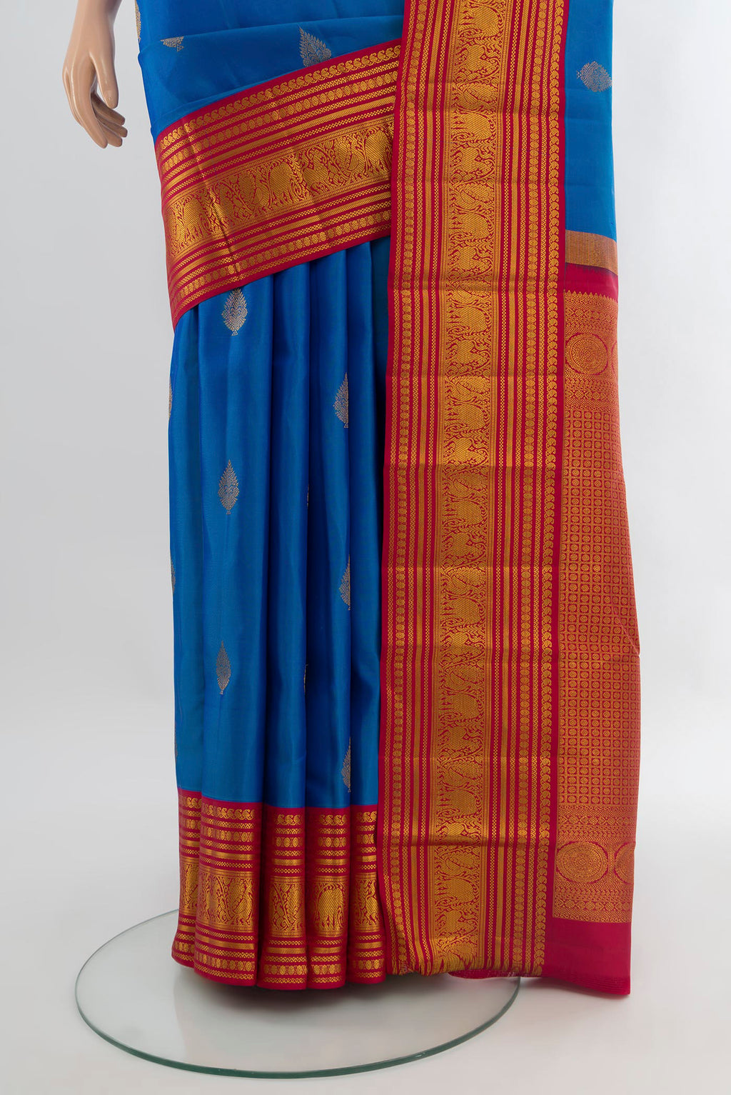 Pleats and pallu of Royal Blue Kanjivaram Silk Saree with Zari Butta on the body and Zari Border. 