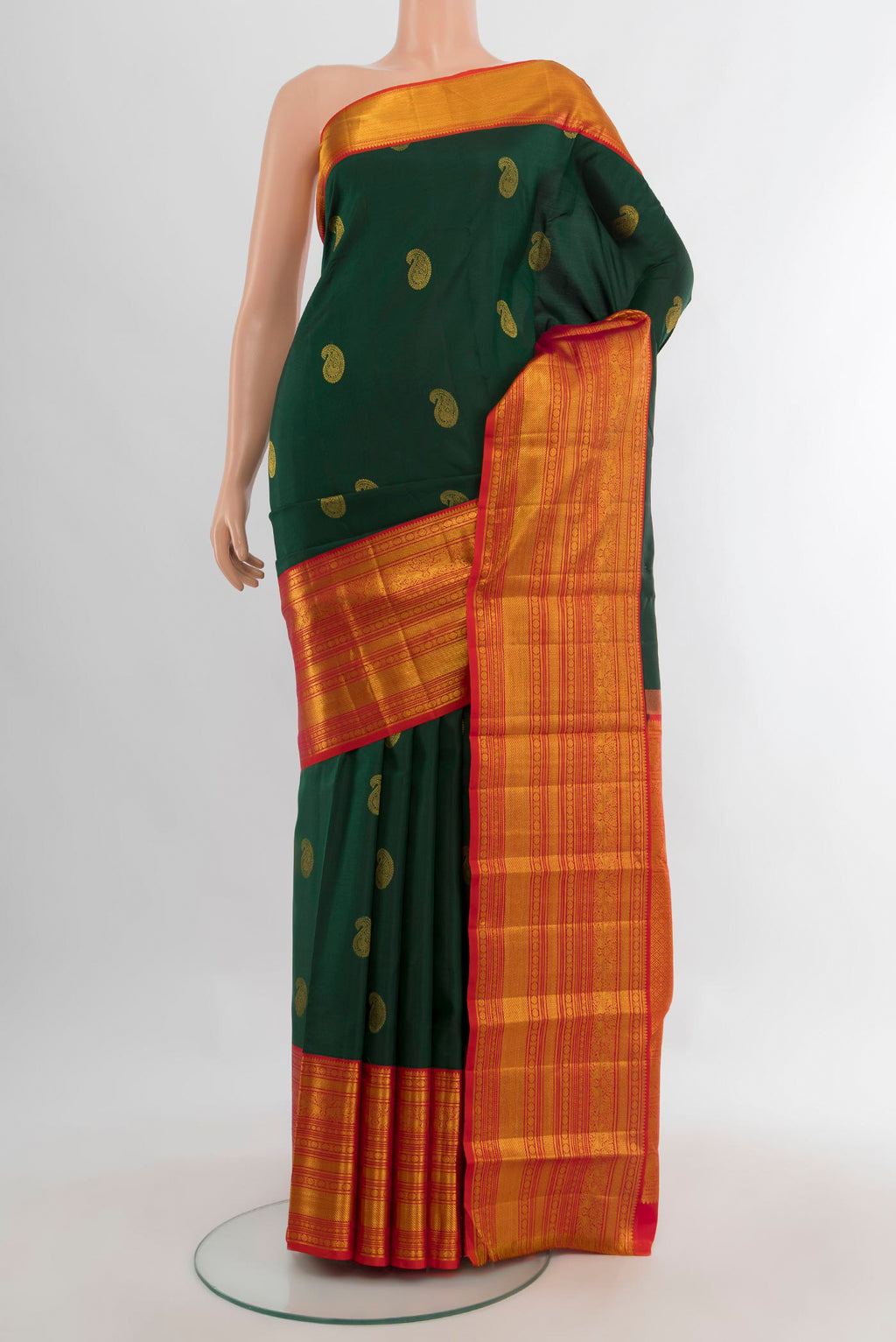 Pure Silk Bottle Green Kanjivaram Saree with Zari Butta on the body and Zari Border.  displayed on a mannequin