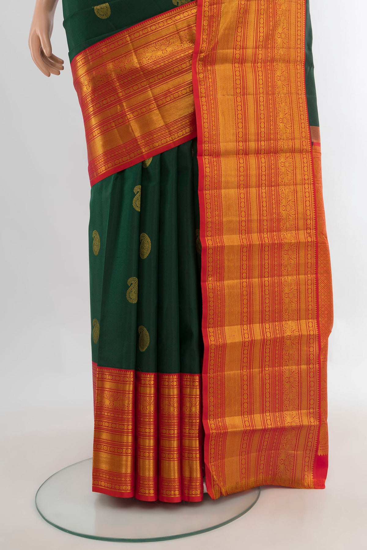 Pleats and pallu of Pure Silk Bottle Green Kanjivaram Saree with Zari Butta on the body and Zari Border. 