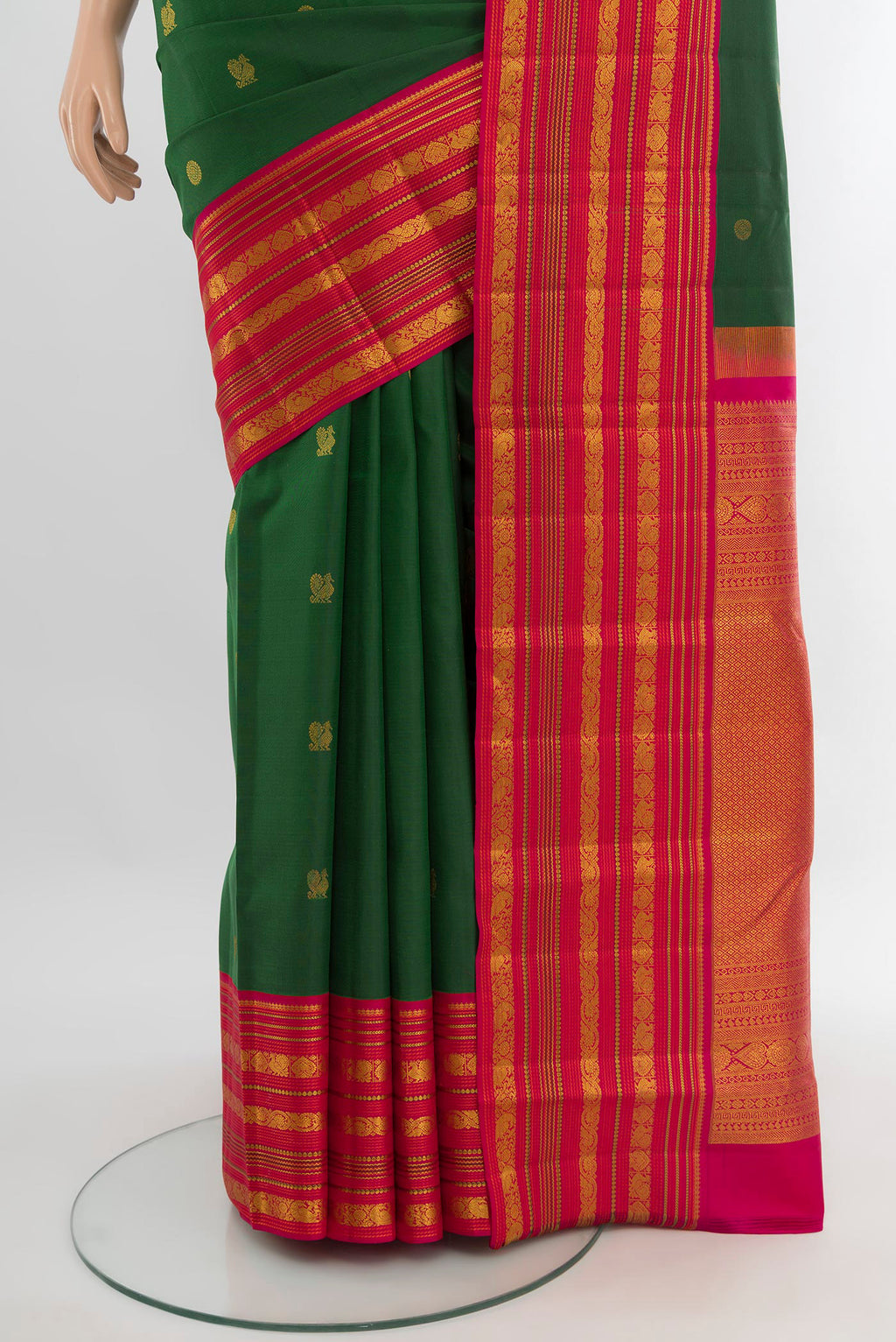 Pleats and pallu of Bottle Green Kanjivaram Silk Saree with Zari Butta on the body and Zari Border. 