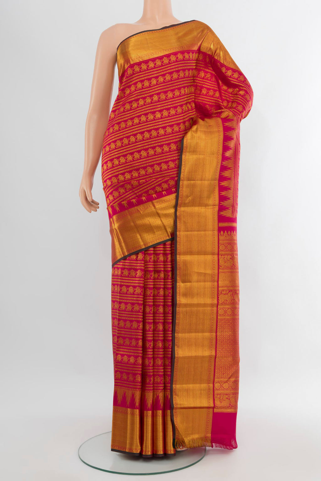 Dark Pink Kanjivaram Silk Saree with Zari Brocade on the body and Zari Border.  displayed on a mannequin