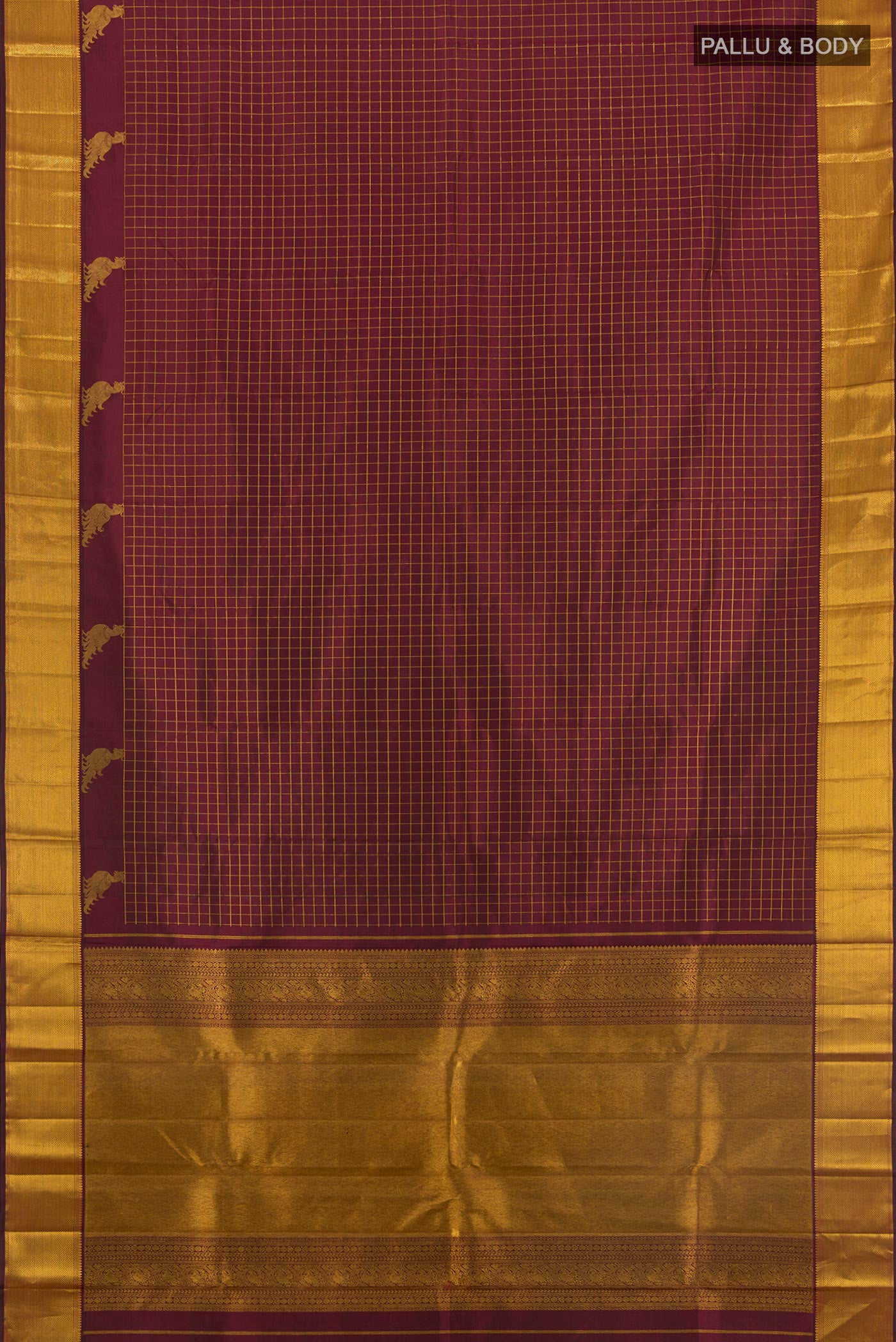 Flat view of Maroon Kanchipuram Silk Saree with Checked design on the body and Zari Border. 