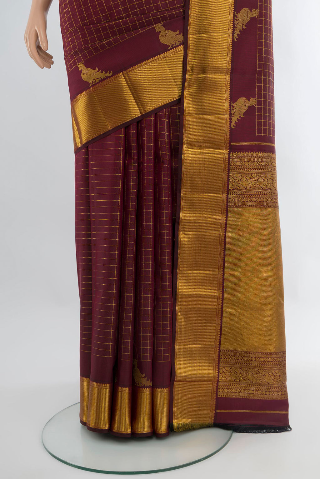 Pleats and pallu of Maroon Kanchipuram Silk Saree with Checked design on the body and Zari Border. 