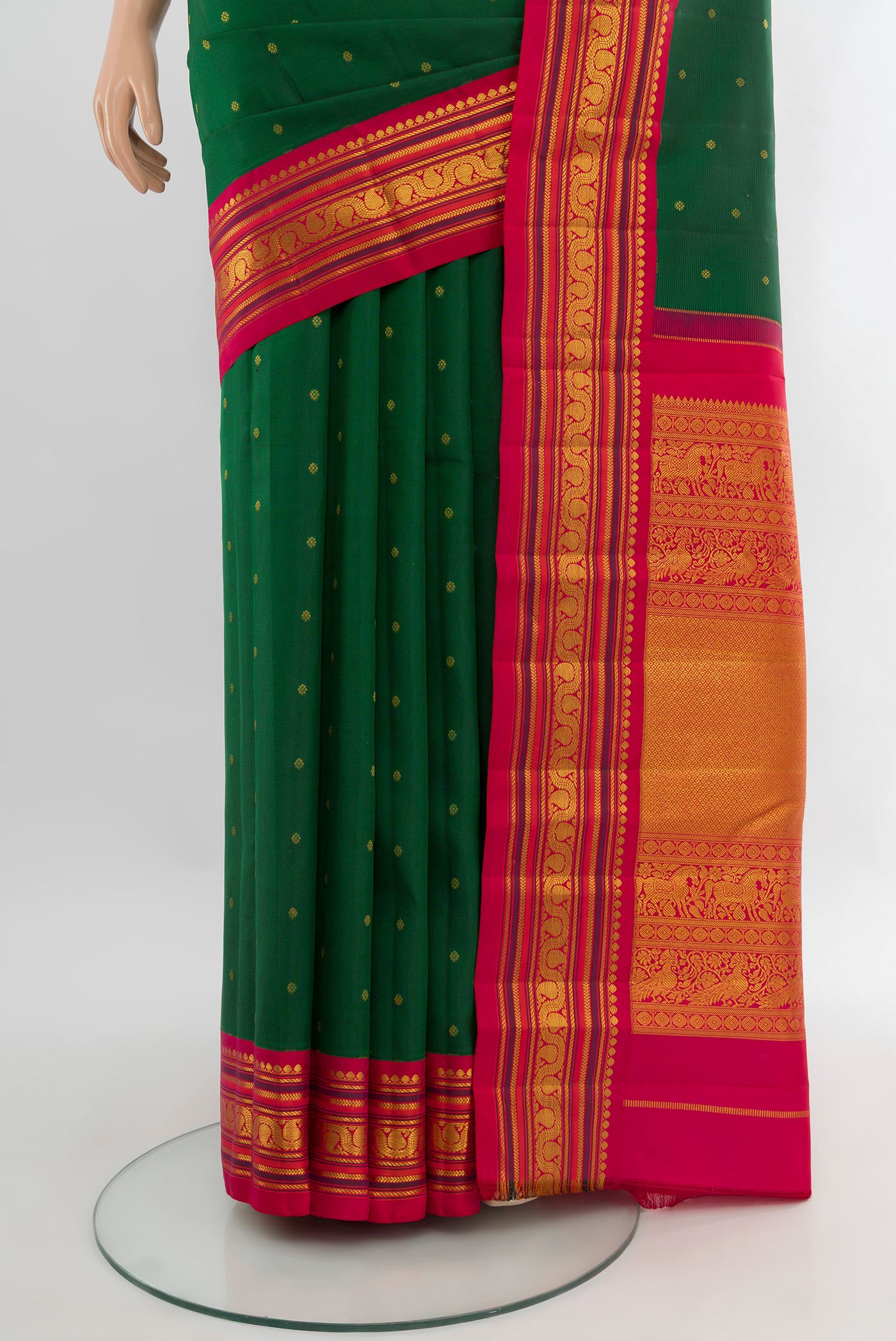 Pleats and pallu of Bottle Green Kanchipuram Silk Saree with Zari Butta on the body and Zari Border. 