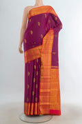 Pure Silk Purple Kanchipuram Saree with Zari Butta on the body and Silk Border.  displayed on a mannequin