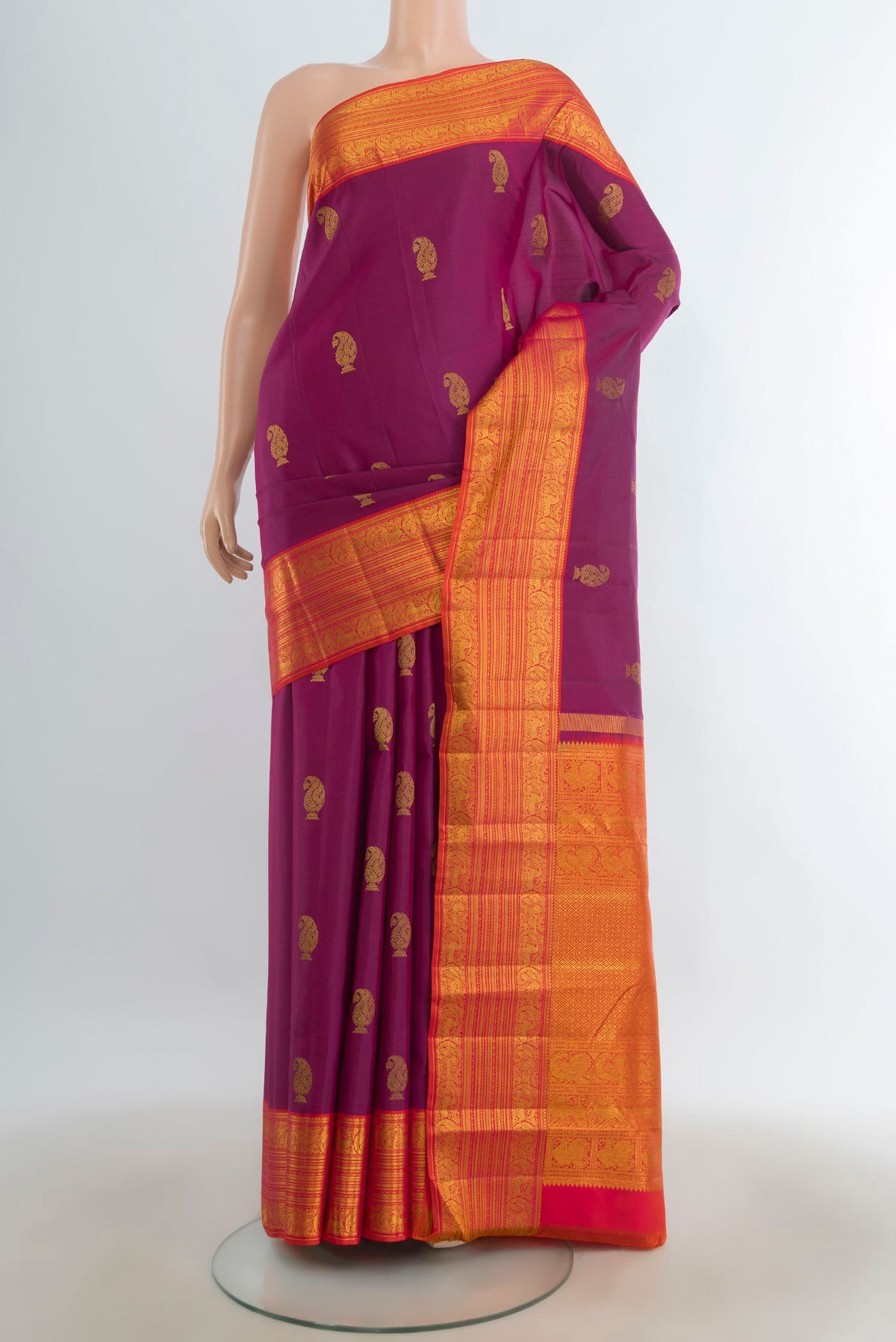 Pure Silk Purple Kanchipuram Saree with Zari Butta on the body and Silk Border.  displayed on a mannequin