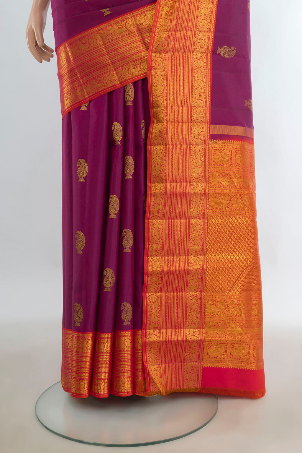 Pleats and pallu of Pure Silk Purple Kanchipuram Saree with Zari Butta on the body and Silk Border. 
