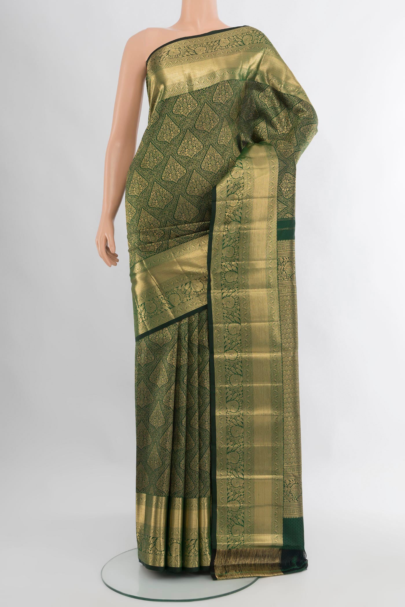 Bottle Green Kanchipuram Silk Saree with Zari Brocade on the body and Zari Border.  displayed on a mannequin