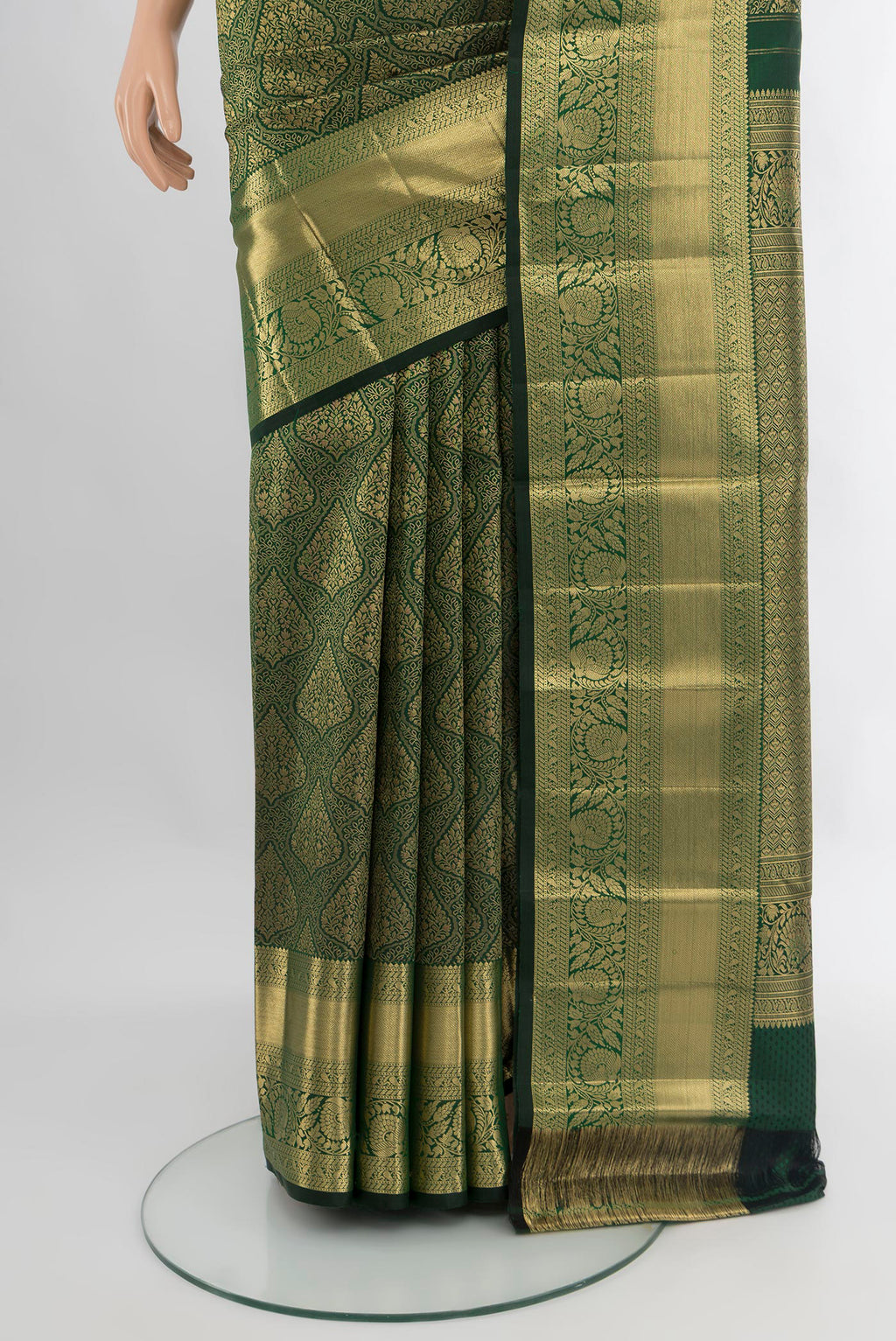 Pleats and pallu of Bottle Green Kanchipuram Silk Saree with Zari Brocade on the body and Zari Border. 