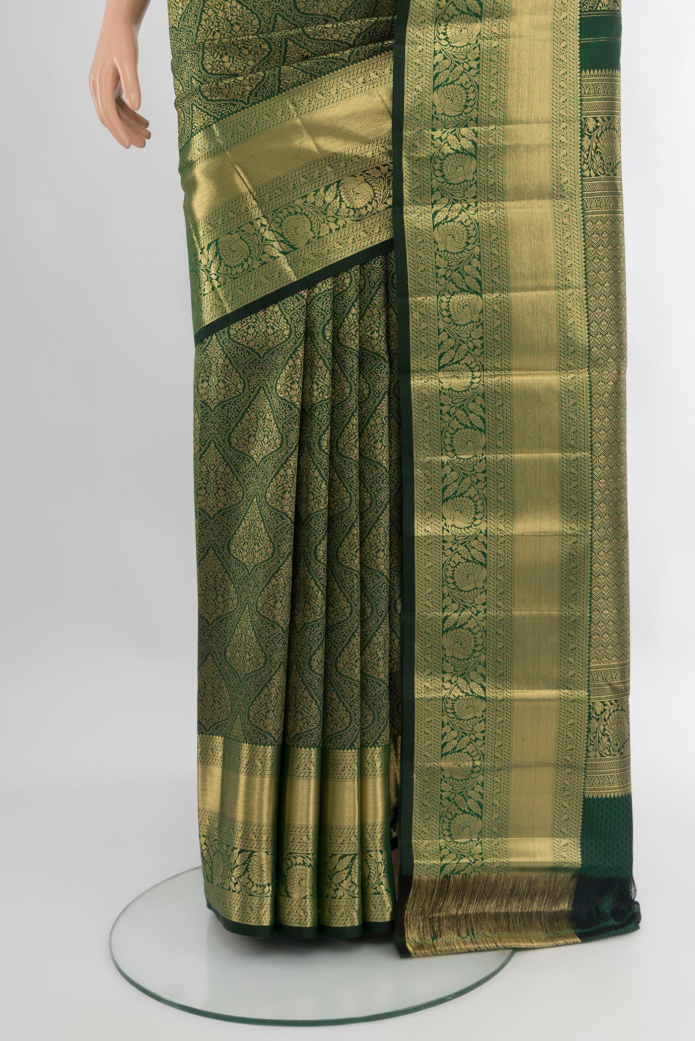 Pleats and pallu of Bottle Green Kanchipuram Silk Saree with Zari Brocade on the body and Zari Border. 
