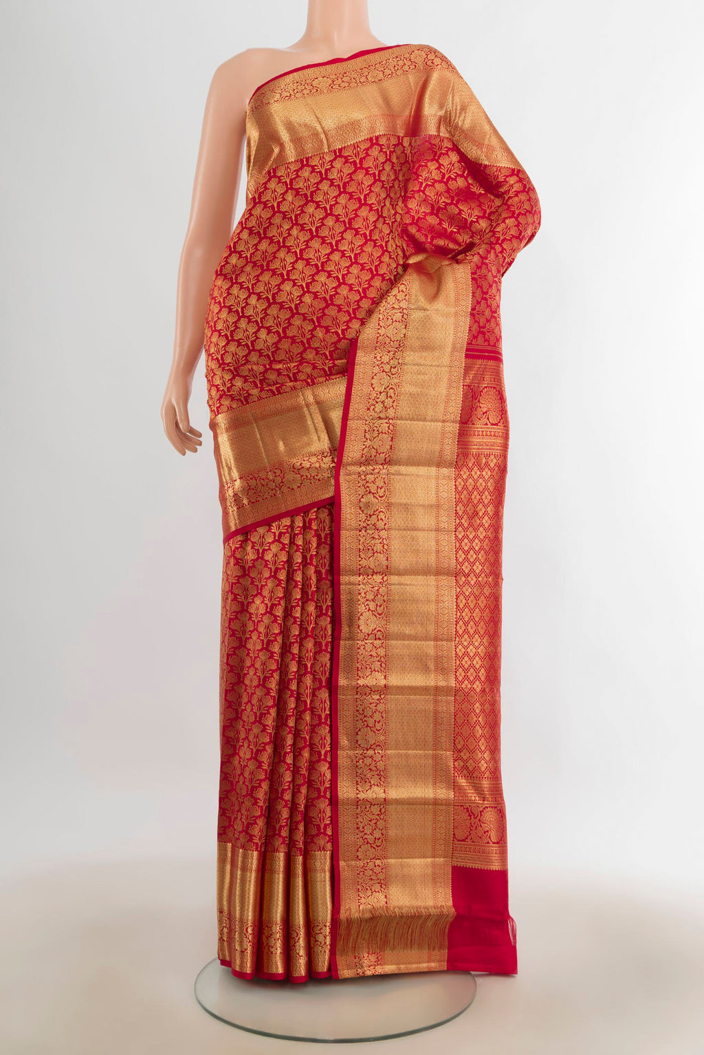 Pure Silk Red Kanchipuram Saree with Zari Butta on the body and Silk Border.  displayed on a mannequin