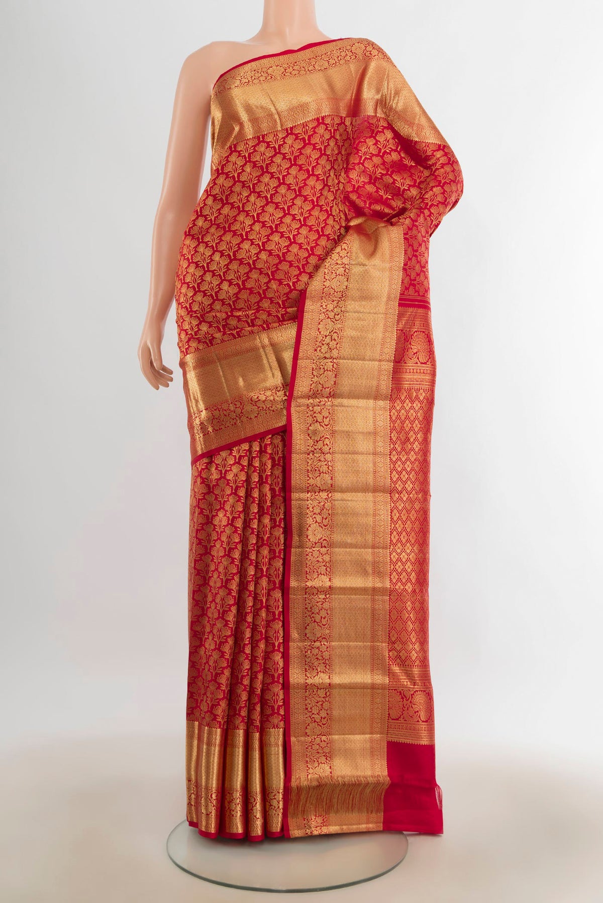 Pure Silk Red Kanchipuram Saree with Zari Butta on the body and Silk Border.  displayed on a mannequin