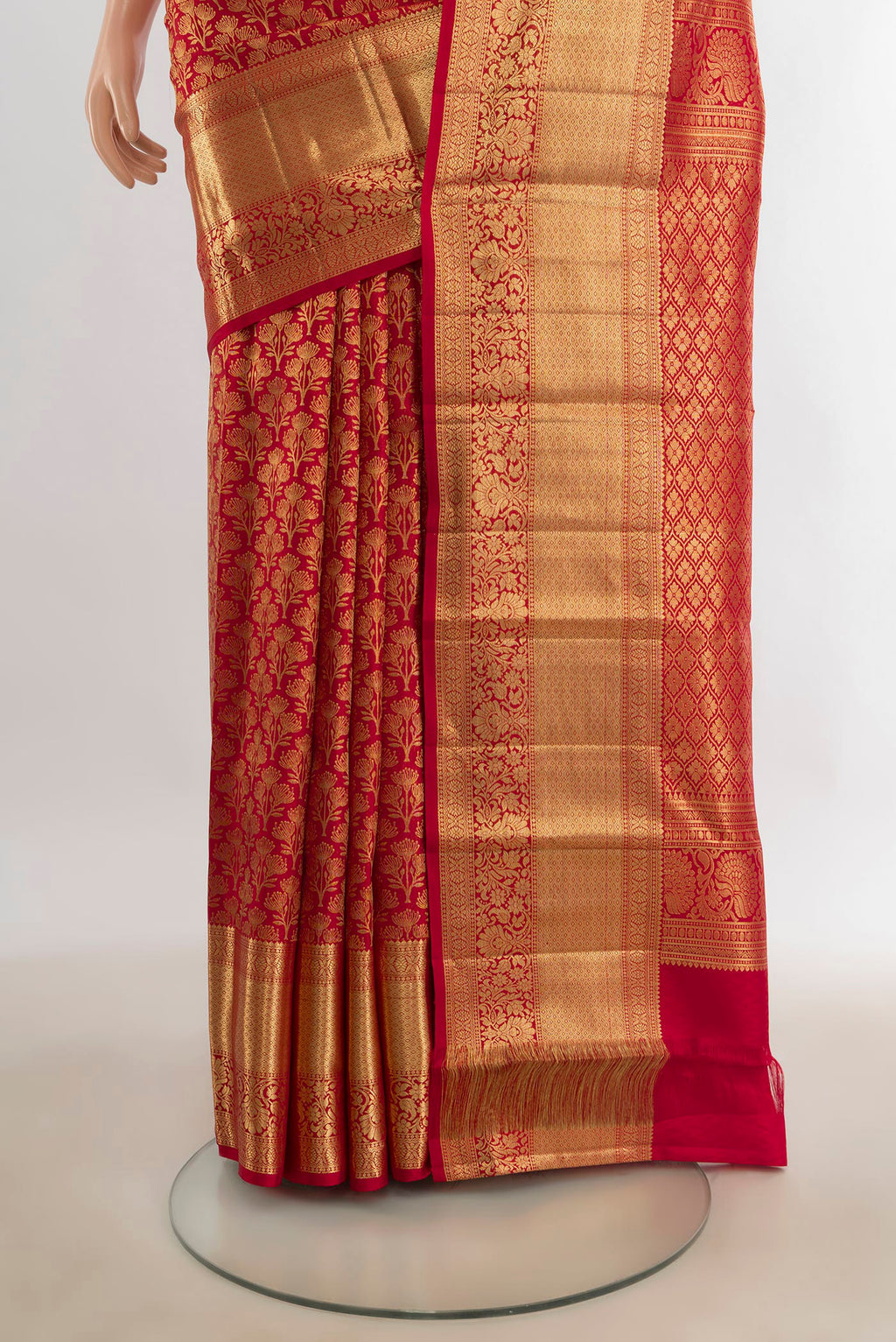 Pleats and pallu of Pure Silk Red Kanchipuram Saree with Zari Butta on the body and Silk Border. 