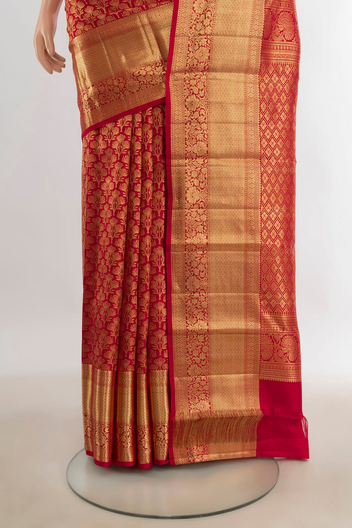 Pleats and pallu of Pure Silk Red Kanchipuram Saree with Zari Butta on the body and Silk Border. 