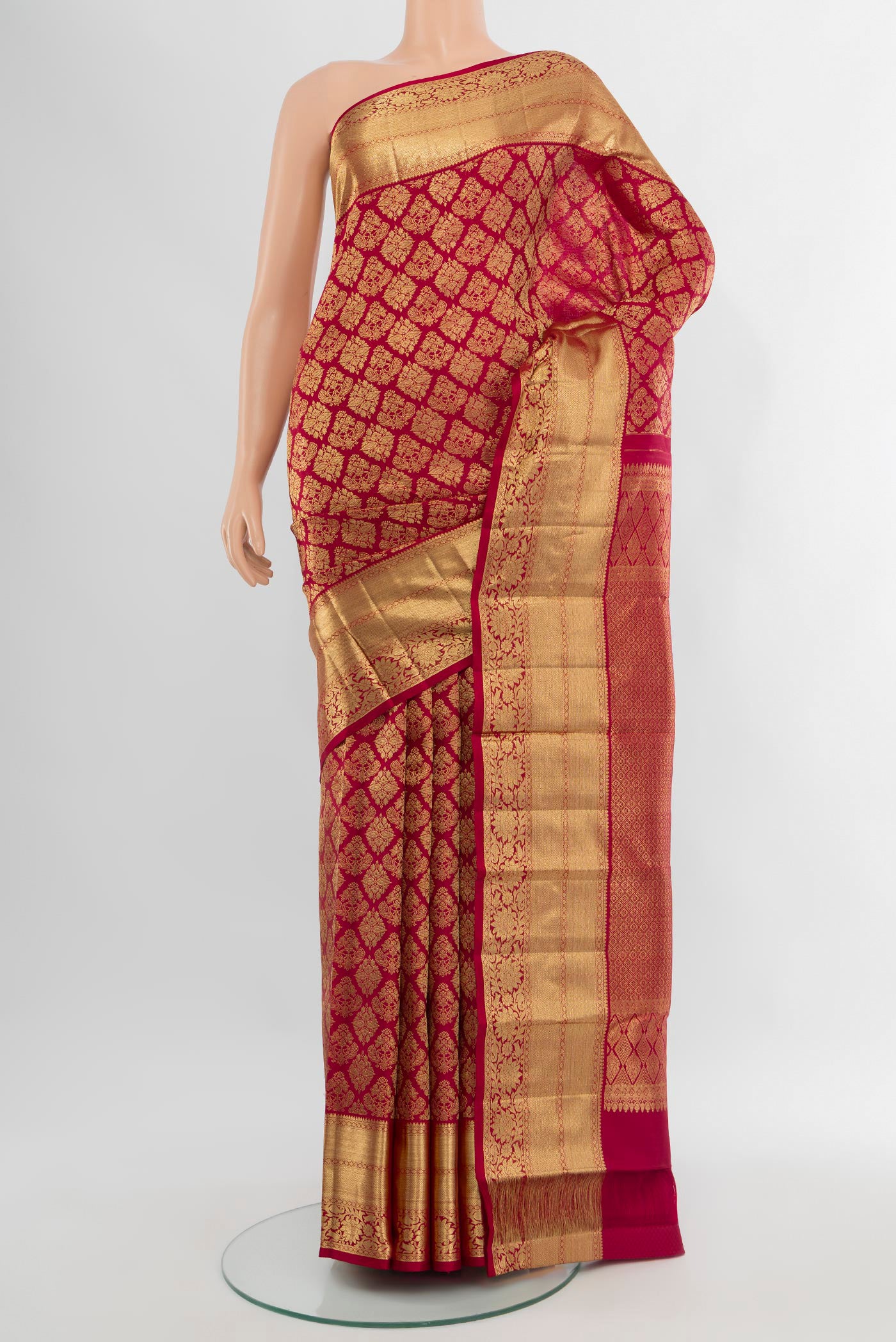 Maroon Kanchipuram Silk Saree with Zari Brocade on the body and Zari Border.  displayed on a mannequin