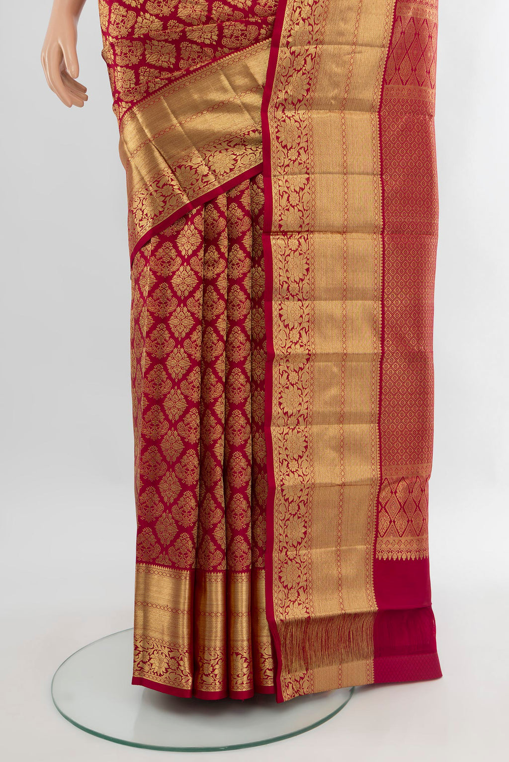 Pleats and pallu of Maroon Kanchipuram Silk Saree with Zari Brocade on the body and Zari Border. 