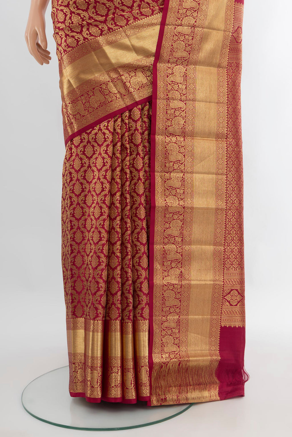 Pleats and pallu of Maroon Kanchipuram Silk Saree with Zari Brocade on the body and Zari Border. 
