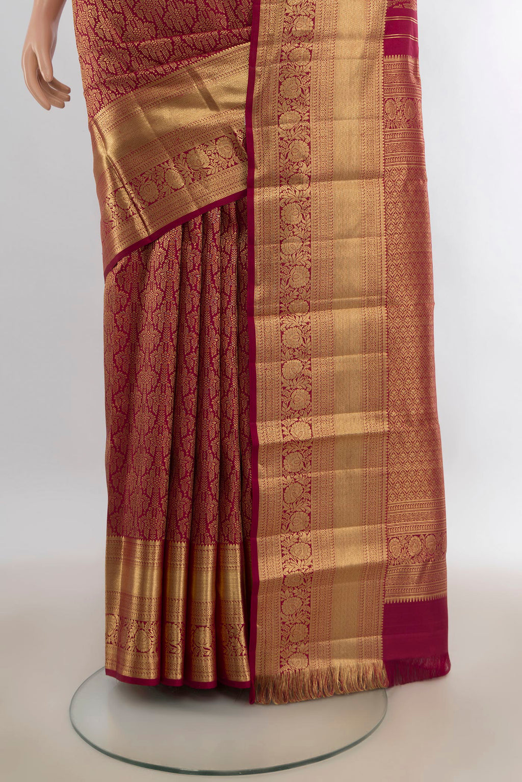 Pleats and pallu of Pure Silk Maroon Kanchipuram Saree with Zari Brocade on the body and Zari Border. 