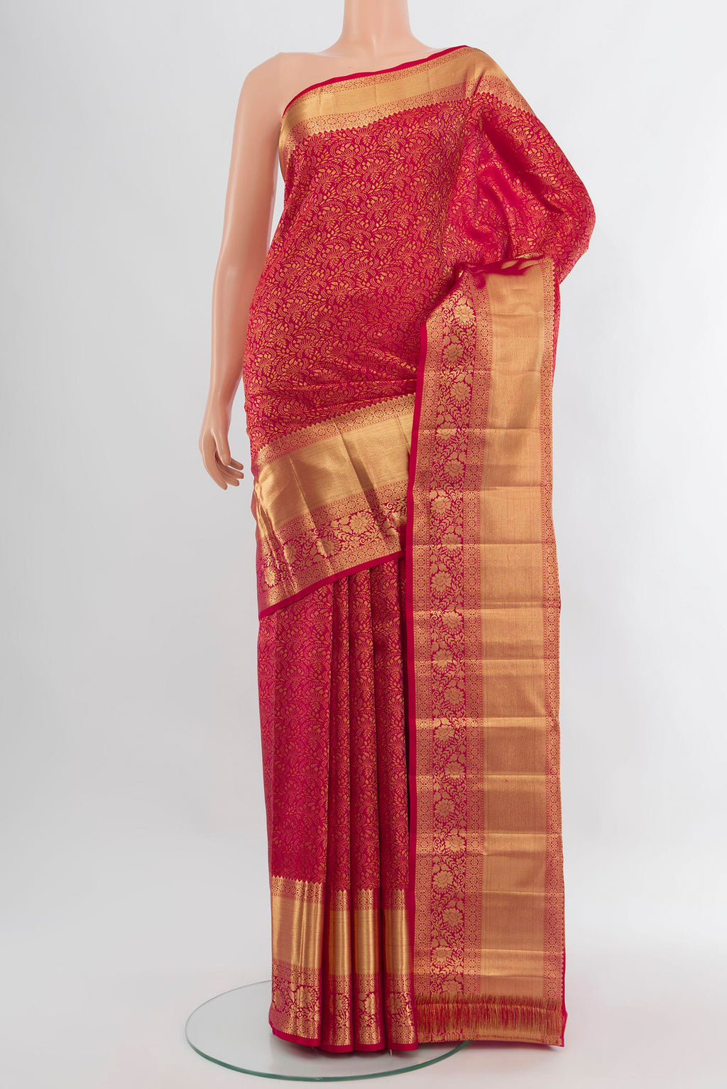 Dark Pink Kanchipuram Silk Saree with Zari Butta on the body and Zari Border.  displayed on a mannequin