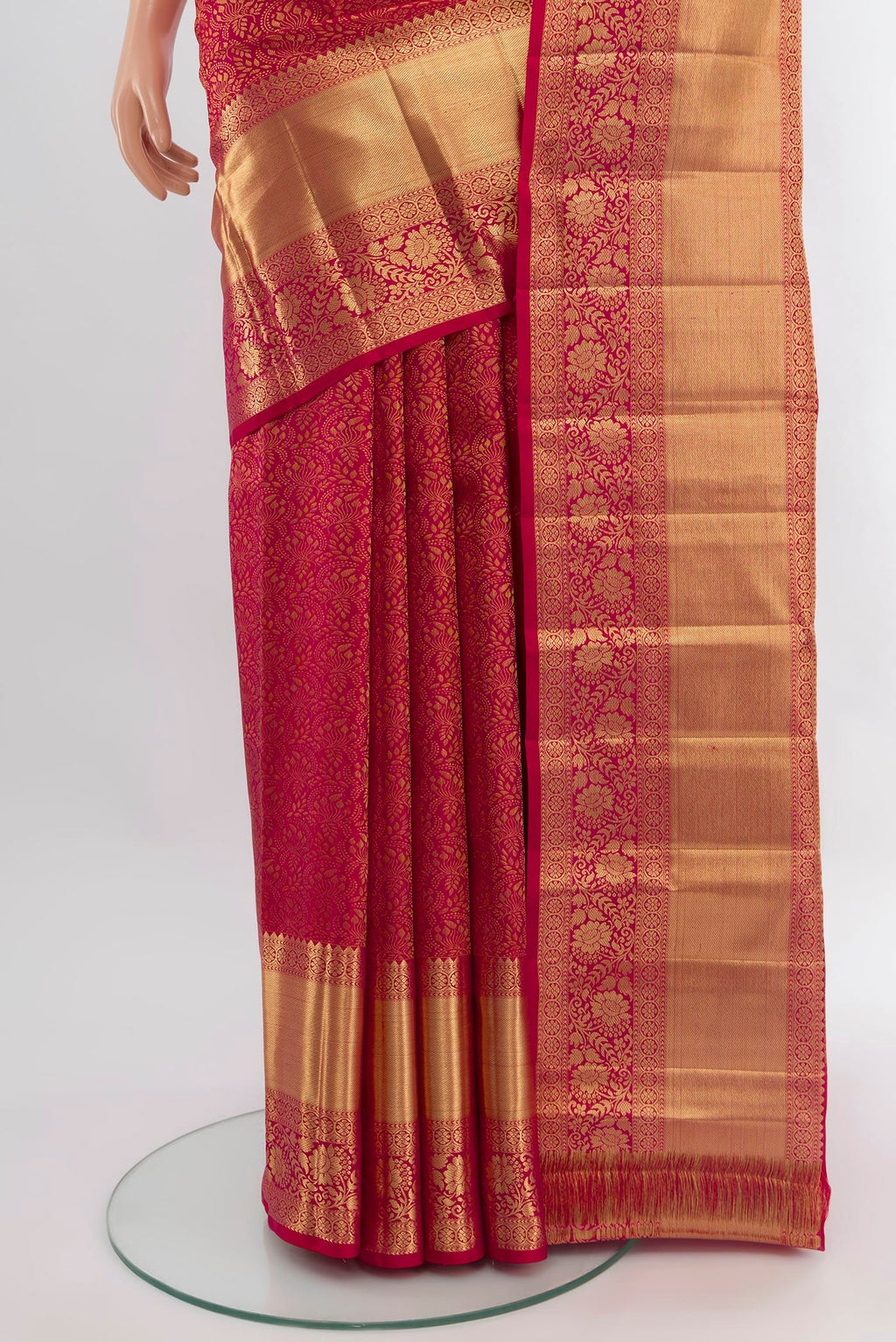 Pleats and pallu of Dark Pink Kanchipuram Silk Saree with Zari Butta on the body and Zari Border. 