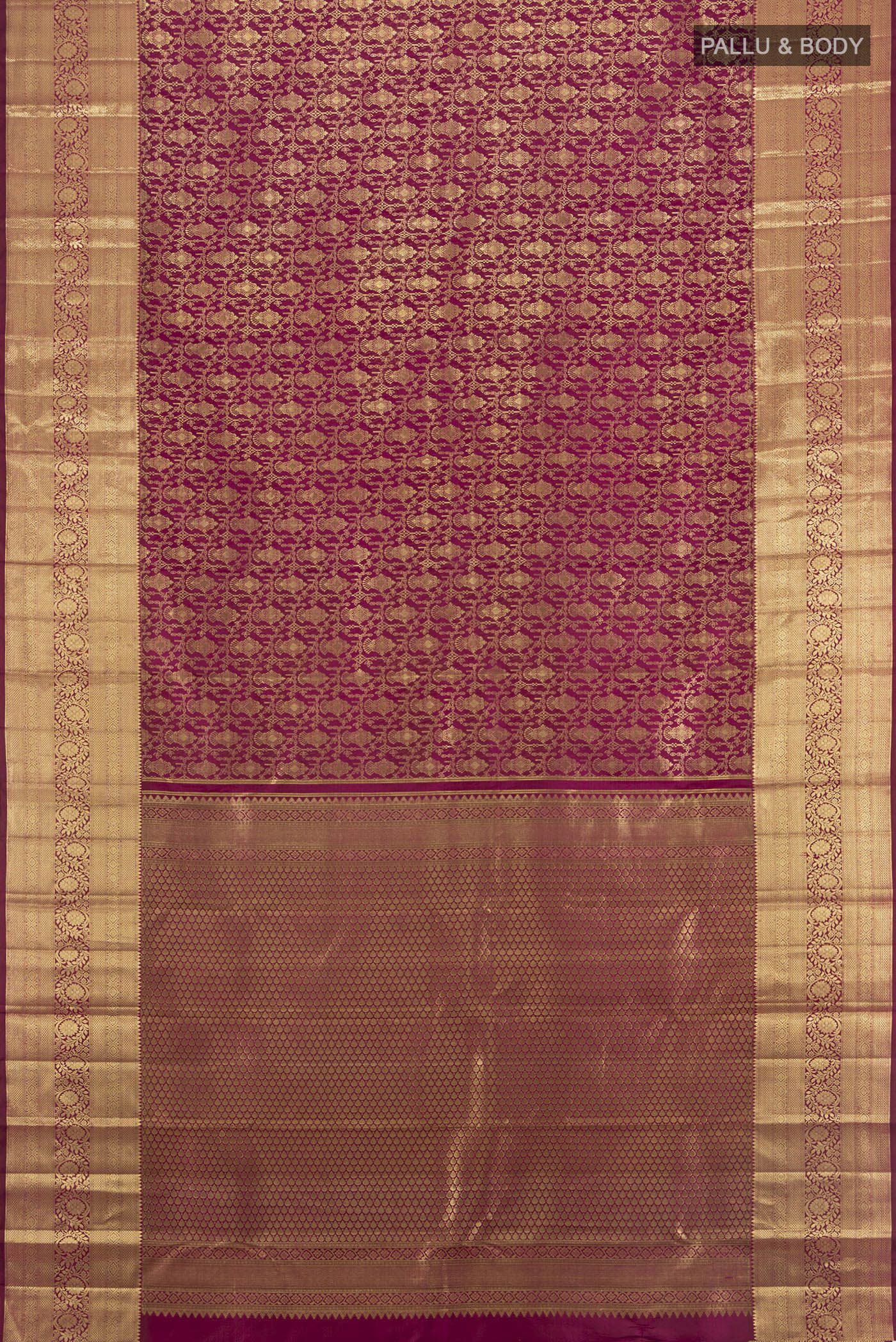 Flat view of Magenta Kanchipuram Silk Saree with Zari Brocade on the body and Zari Border. 