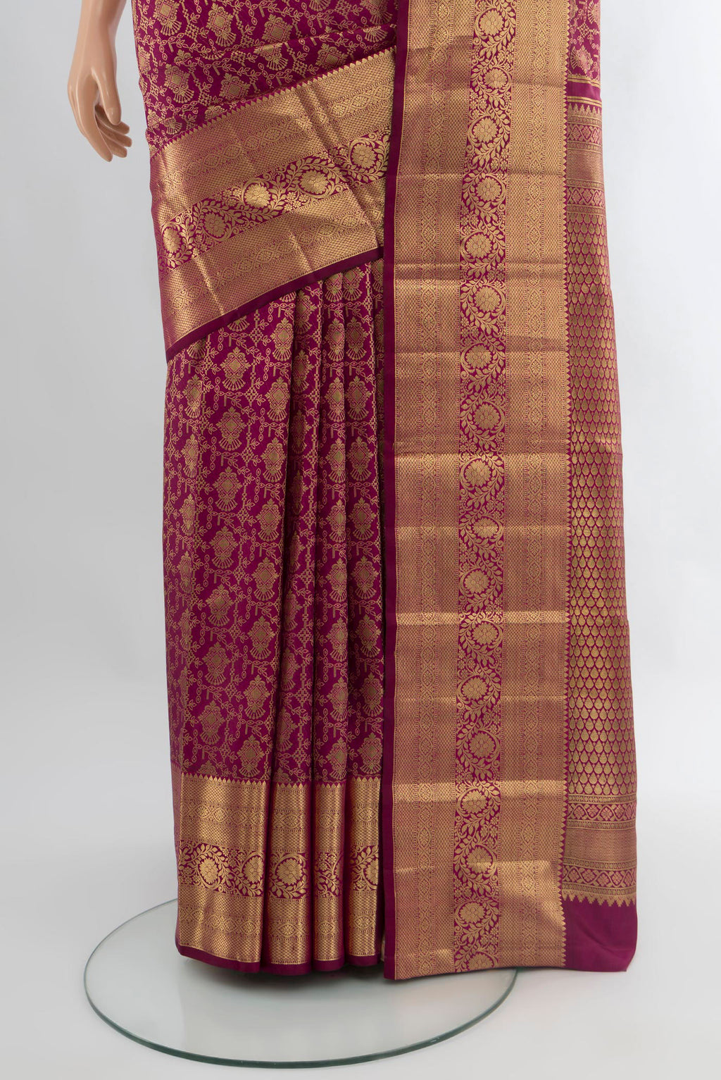 Pleats and pallu of Magenta Kanchipuram Silk Saree with Zari Brocade on the body and Zari Border. 