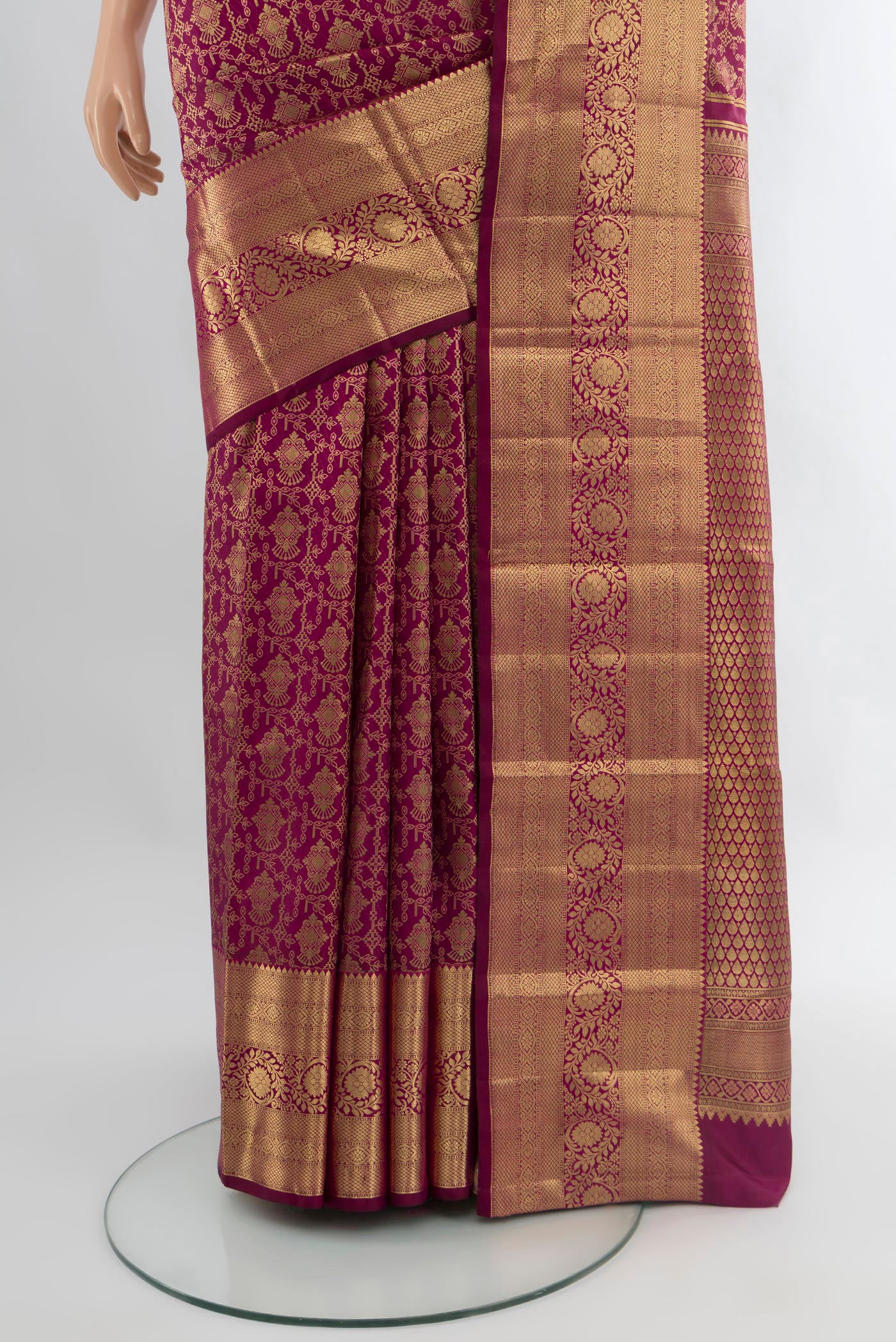 Pleats and pallu of Magenta Kanchipuram Silk Saree with Zari Brocade on the body and Zari Border. 