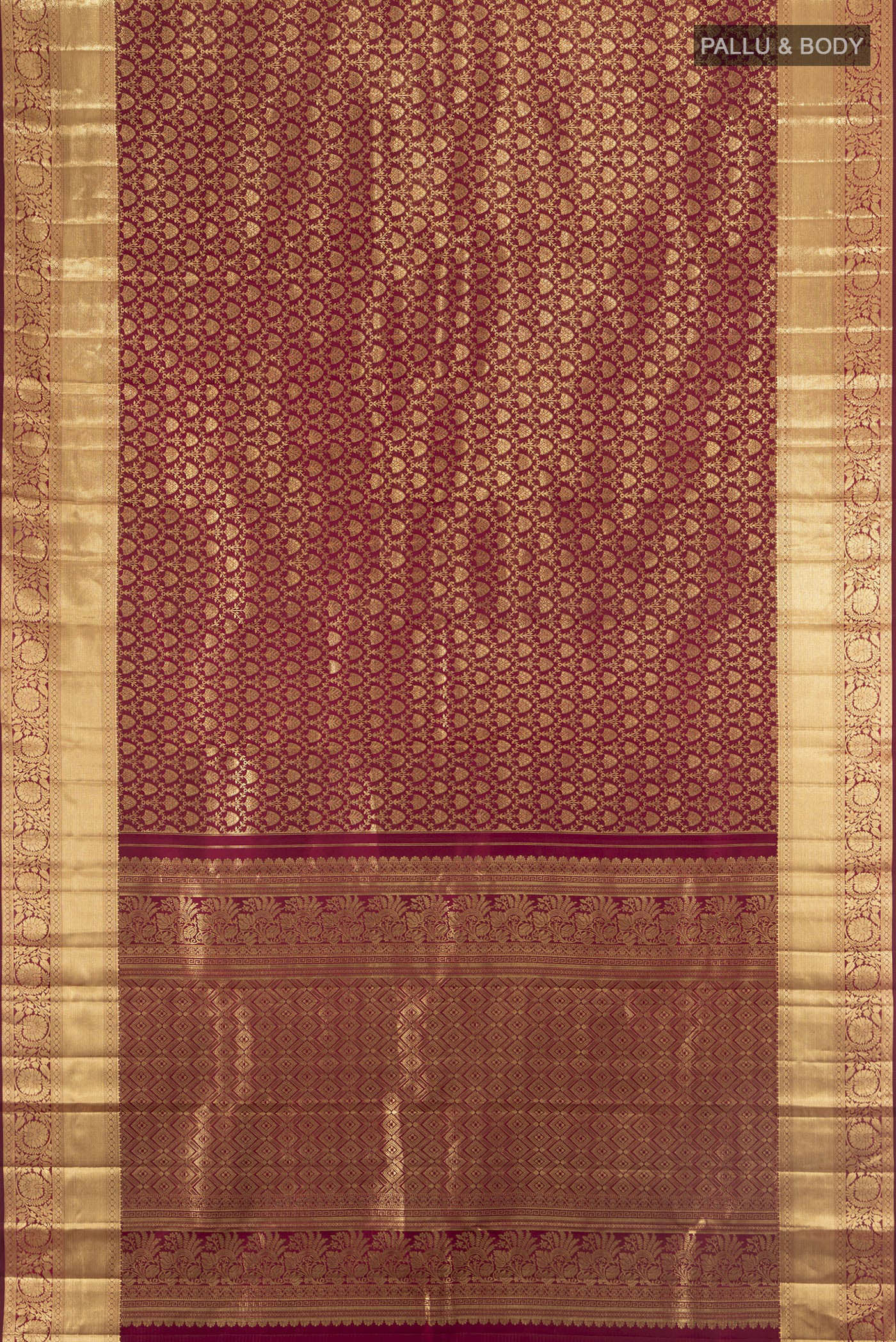 Flat view of Maroon Kanchipuram Silk Saree with Zari Brocade on the body and Zari Border. 