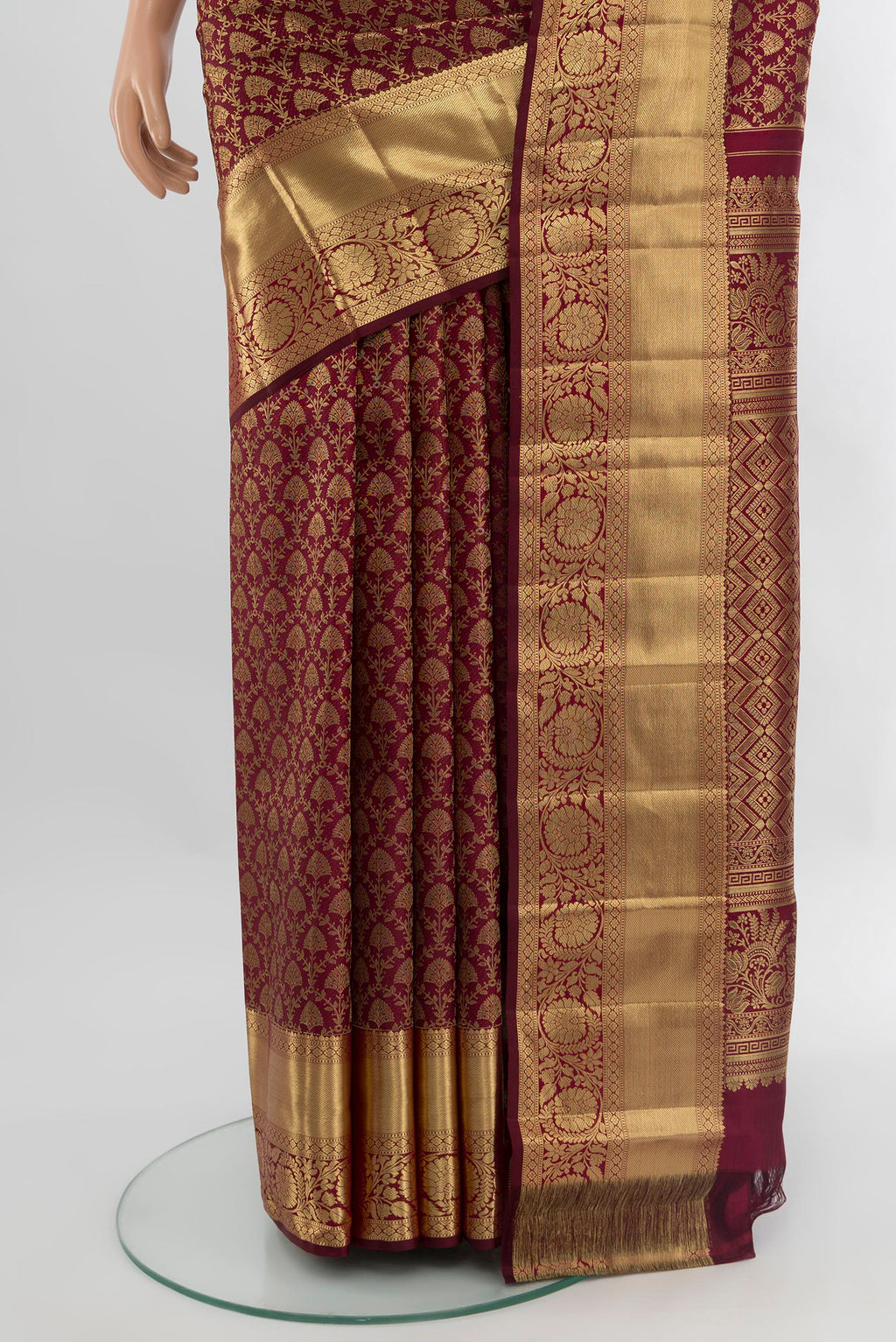 Pleats and pallu of Maroon Kanchipuram Silk Saree with Zari Brocade on the body and Zari Border. 