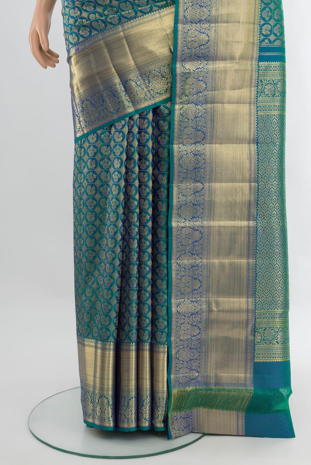 Pleats and pallu of Peacock Blue Dual Tone Kanchipuram Silk Saree with Zari Brocade on the body and Zari Border. 