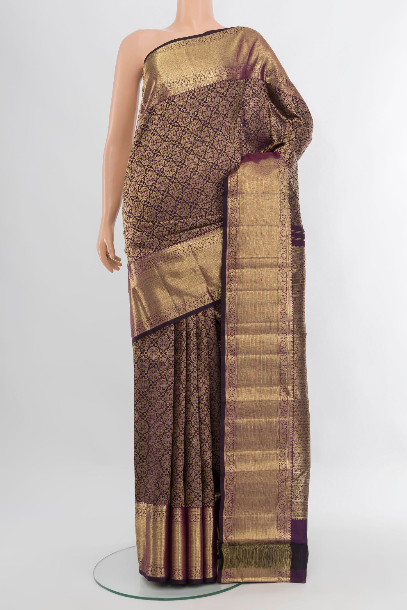 Violet Kanchipuram Silk Saree with Zari Brocade on the body and Zari Border.  displayed on a mannequin