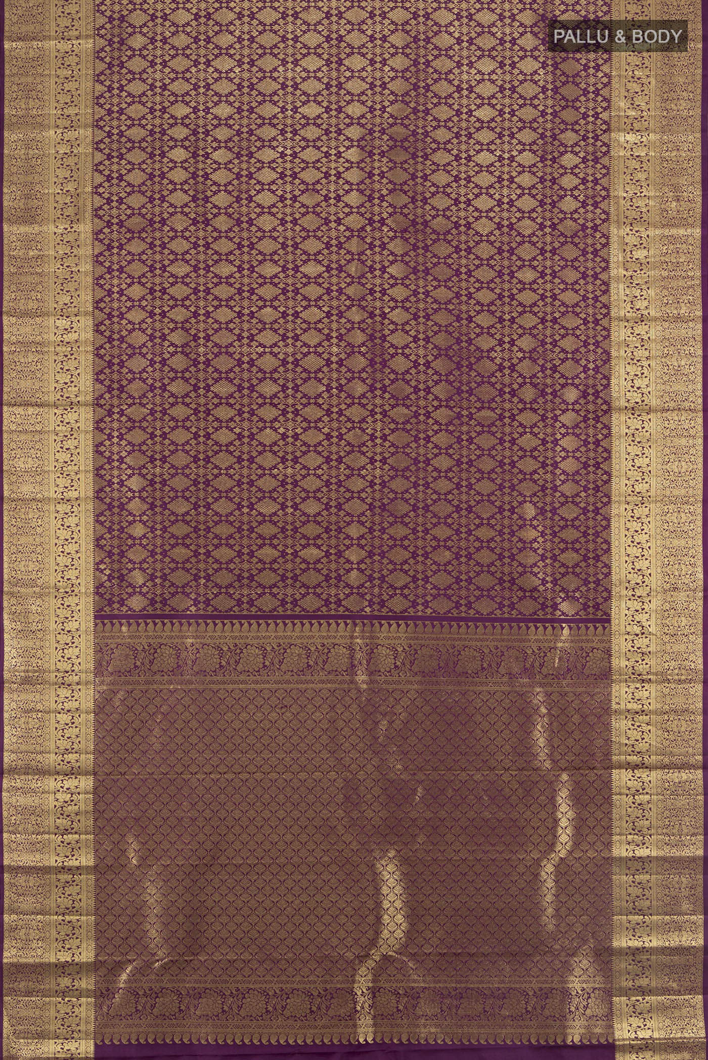 Flat view of Violet Kanchipuram Silk Saree with Zari Brocade on the body and Zari Border. 