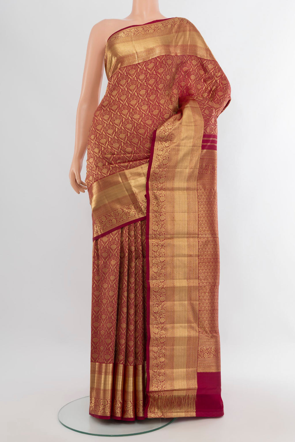 Maroon Kanchipuram Silk Saree with Zari Brocade on the body and Zari Border.  displayed on a mannequin