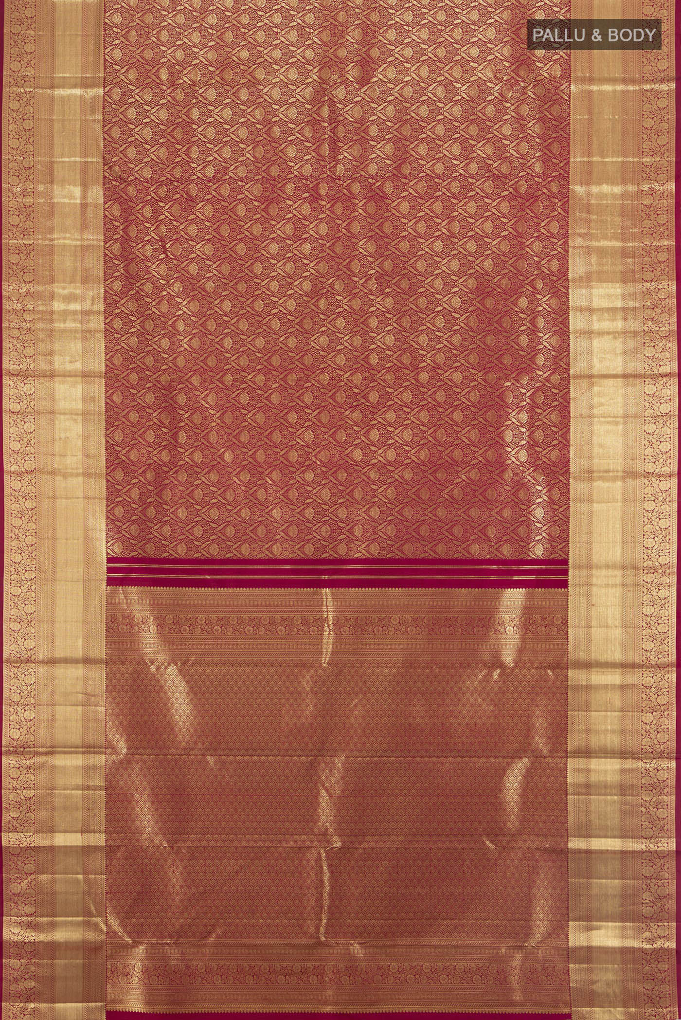 Flat view of Maroon Kanchipuram Silk Saree with Zari Brocade on the body and Zari Border. 