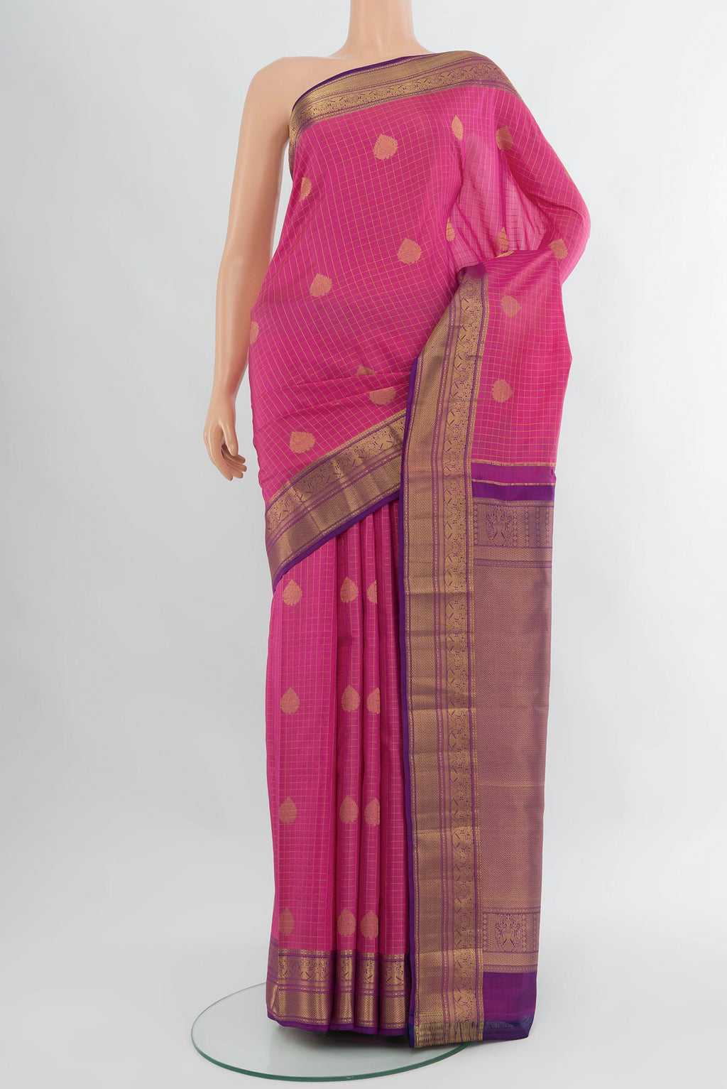 Rose pink Kanjivaram Silk Saree with Checked design on the body and Zari Border.  displayed on a mannequin