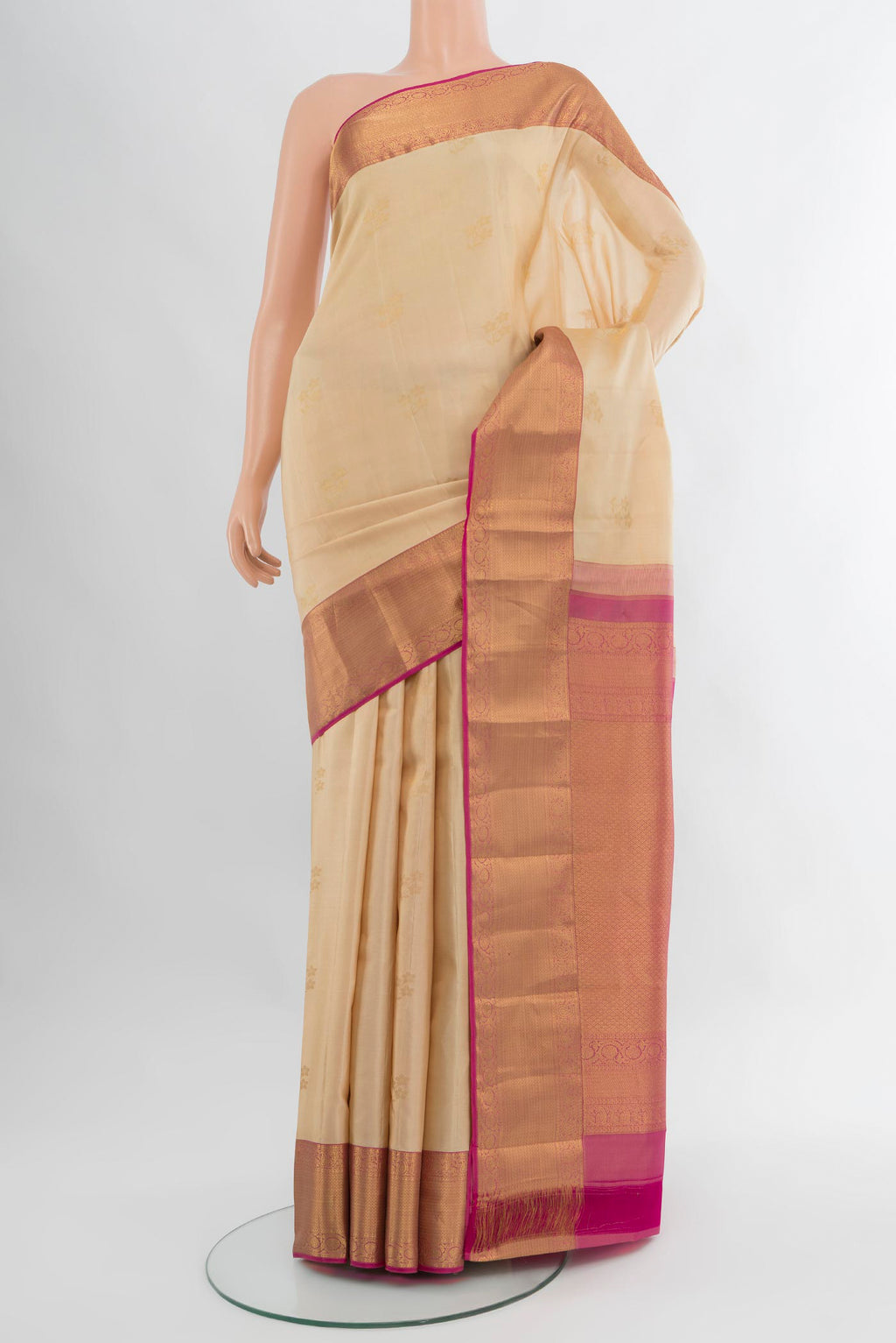 Sandal Kanjivaram Silk Saree with Zari Butta on the body and Zari Border.  displayed on a mannequin