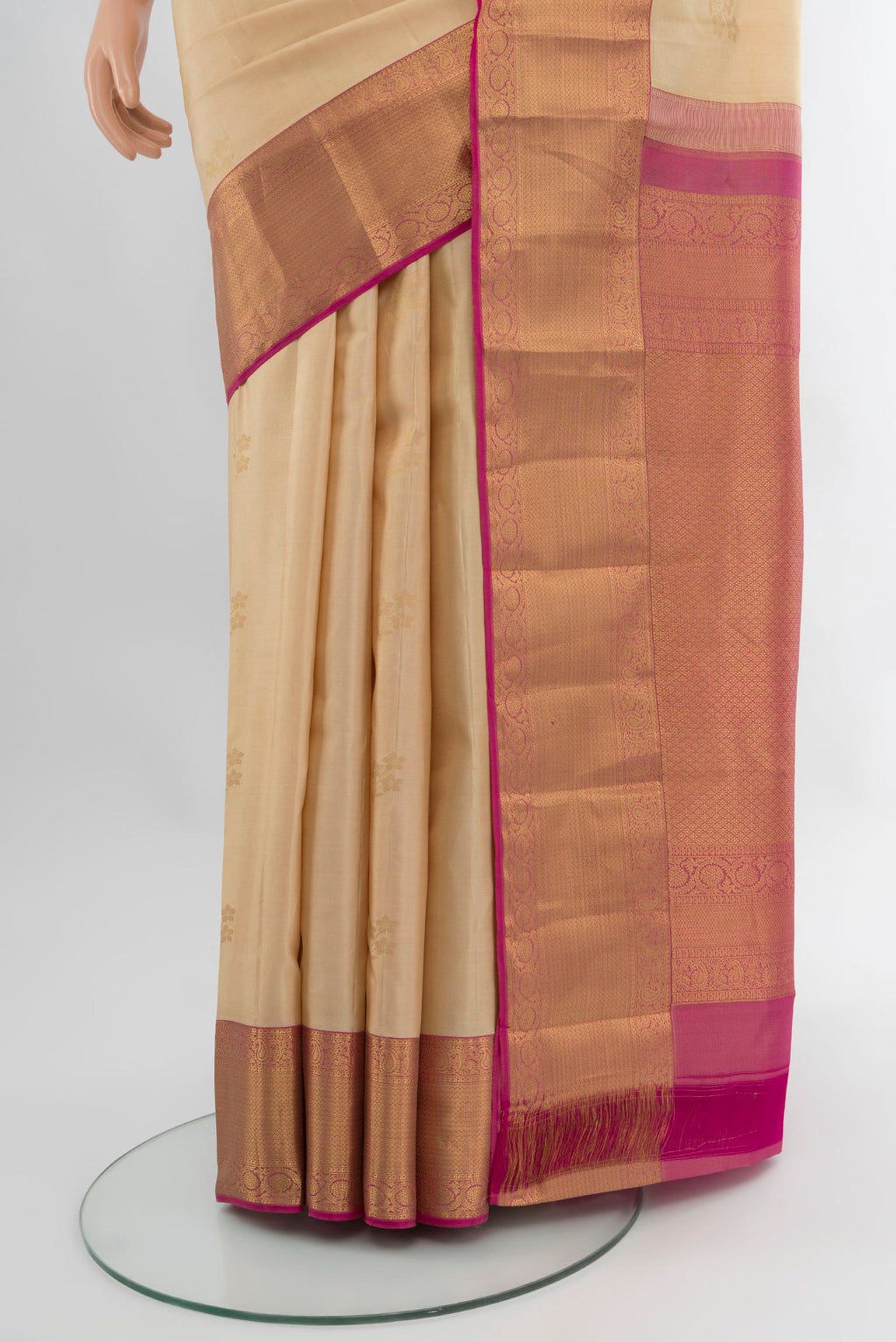 Pleats and pallu of Sandal Kanjivaram Silk Saree with Zari Butta on the body and Zari Border. 
