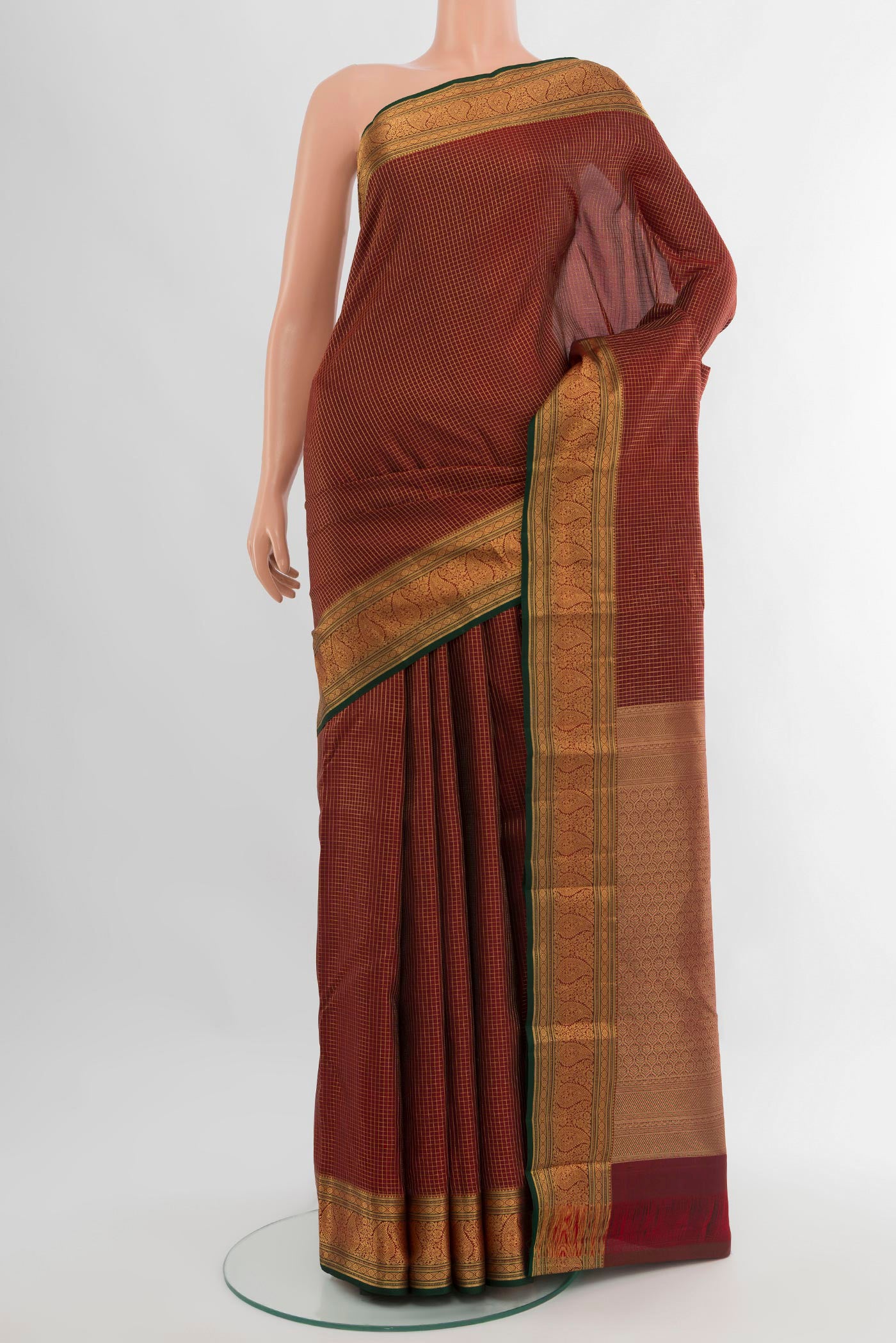 Maroon Kanchipuram Silk Saree with Checked design on the body and Zari Border.  displayed on a mannequin