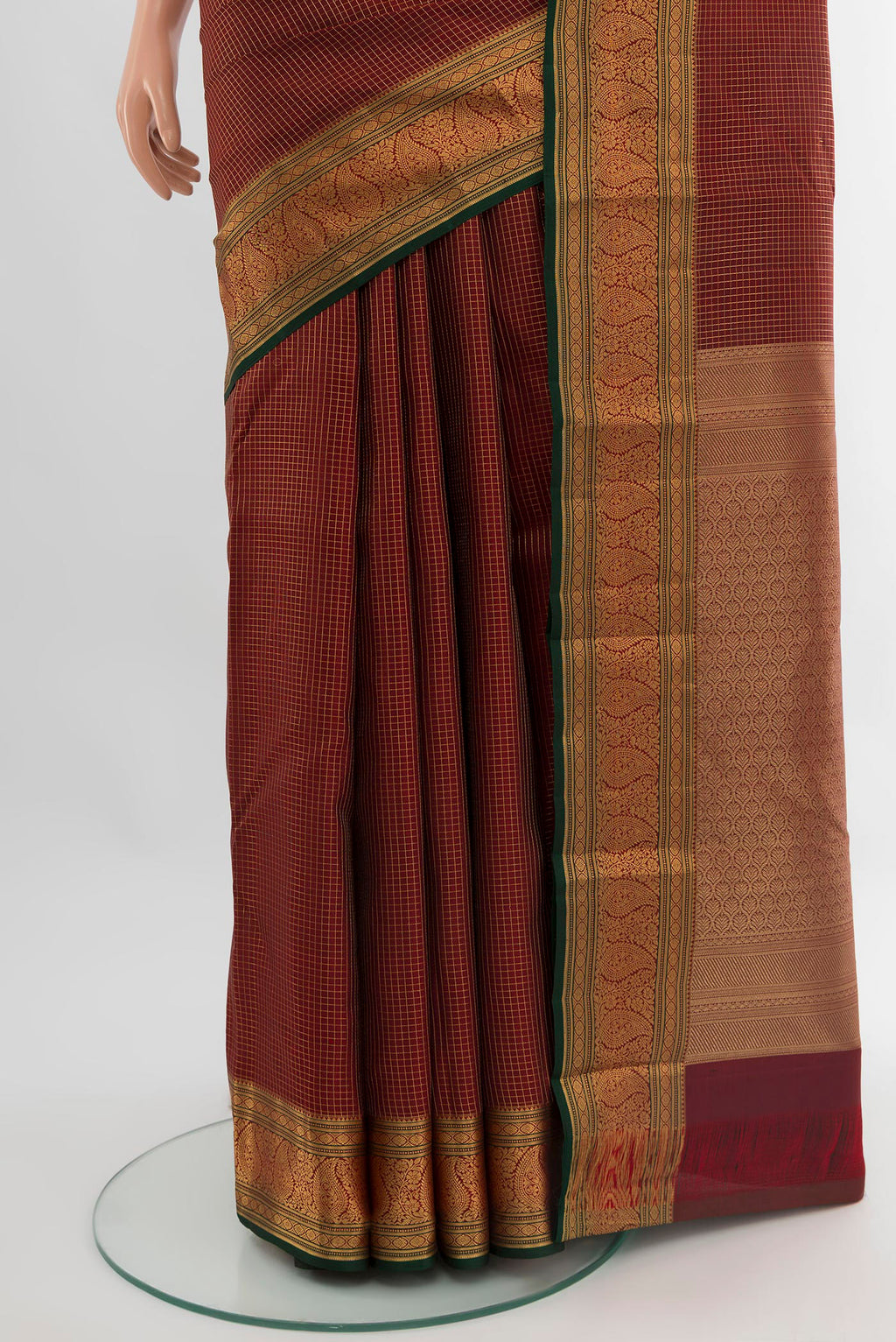 Pleats and pallu of Maroon Kanchipuram Silk Saree with Checked design on the body and Zari Border. 