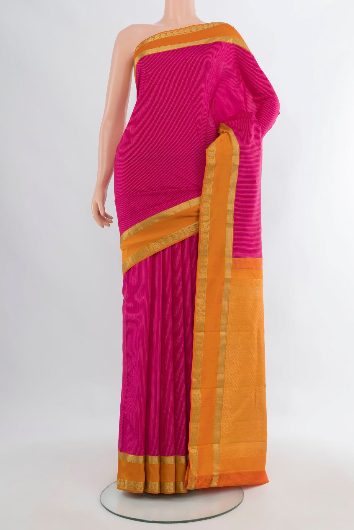 Pure Silk Pink Kanjivaram Saree with Stripes on the body and Zari Border.  displayed on a mannequin
