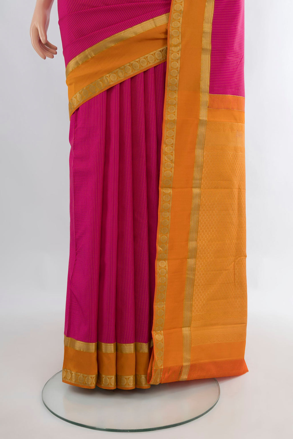 Pleats and pallu of Pure Silk Pink Kanjivaram Saree with Stripes on the body and Zari Border. 