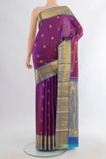 Pure Silk Purple Kanjivaram Saree with Zari Butta on the body and Zari Border.  displayed on a mannequin