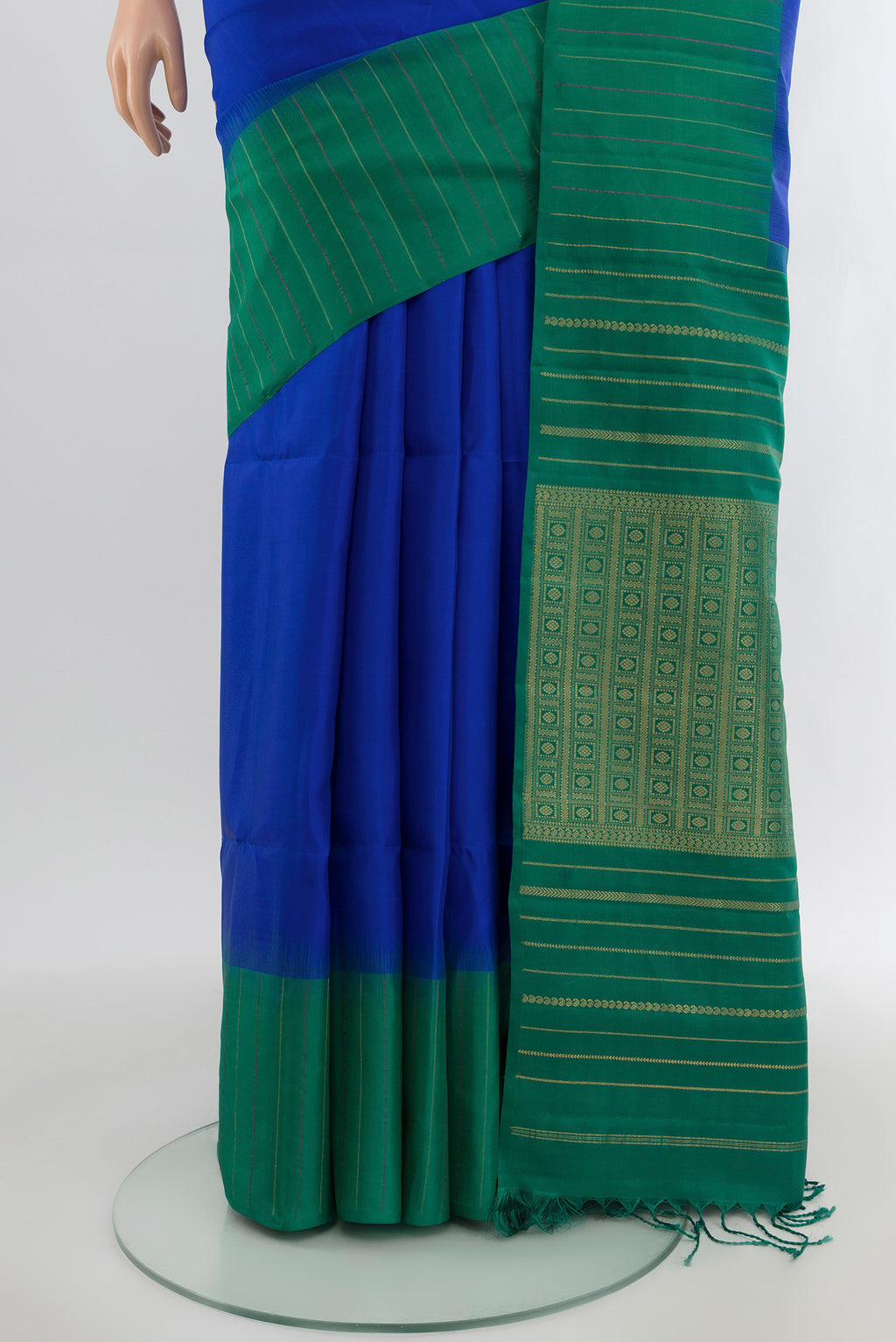 Pleats and pallu of Royal Blue Soft Silk Saree with Zari Butta on the body and Checks Border. 